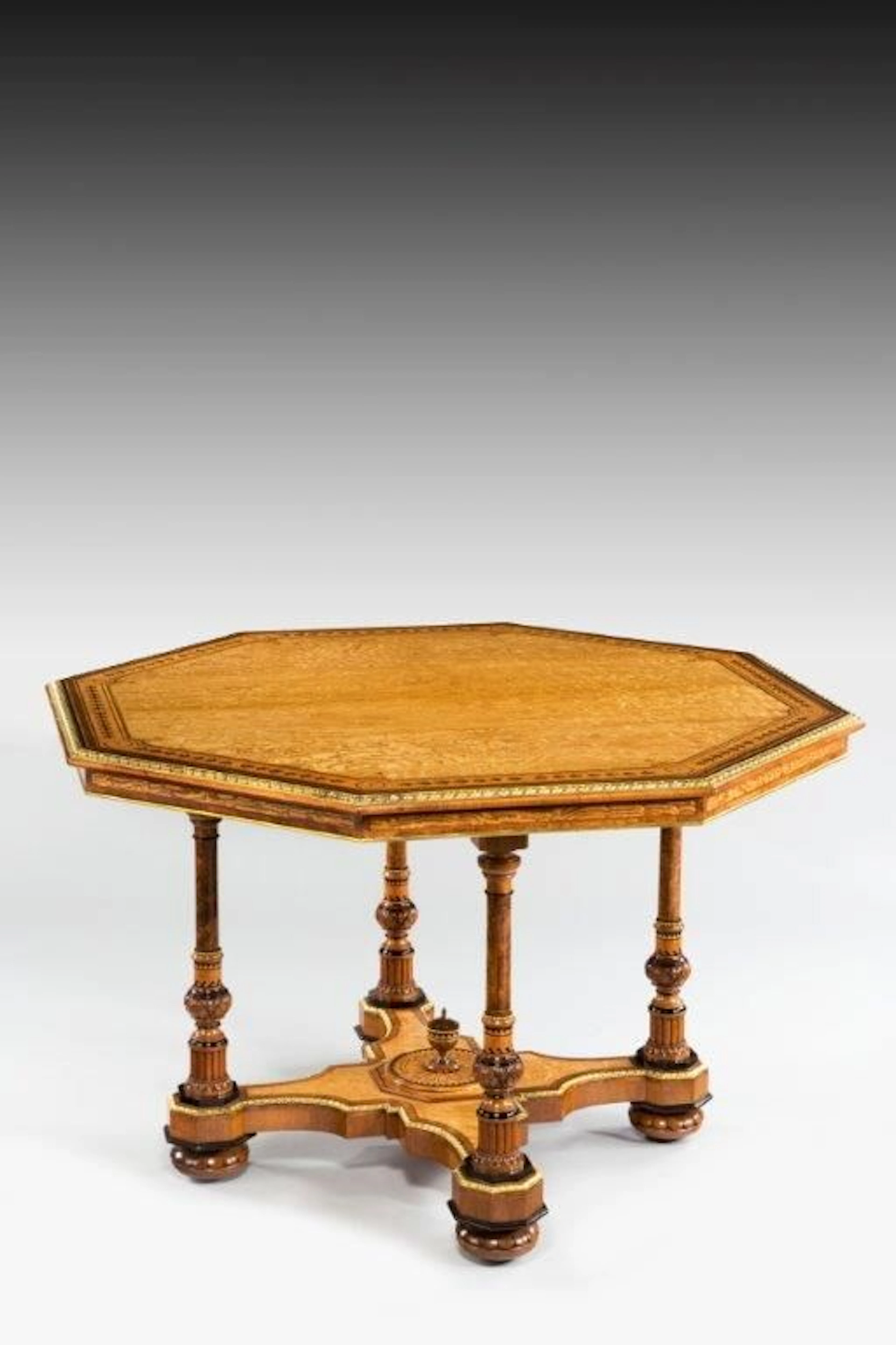 A Hungarian-ash centre table attributed to Holland and Sons
