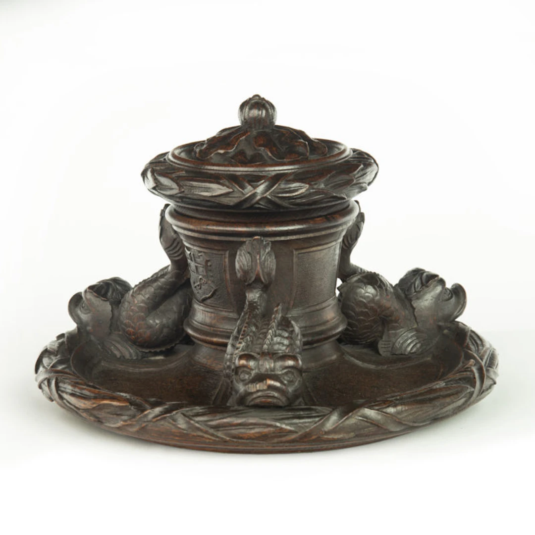 An oak inkwell carved from Lutine timber, dated 1799