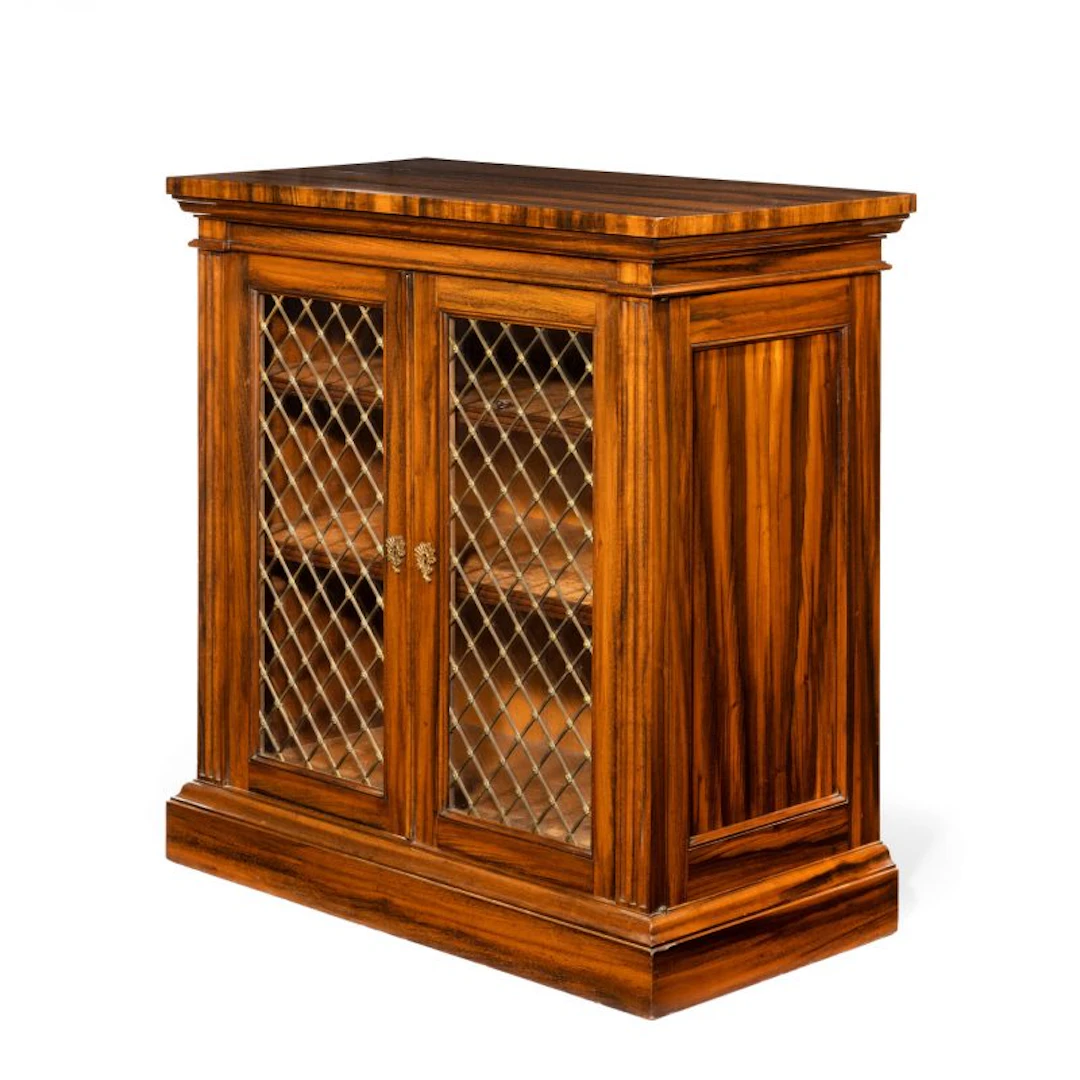 A late Regency Gonçalo Alves two-door side cabinet attributed to Gillows