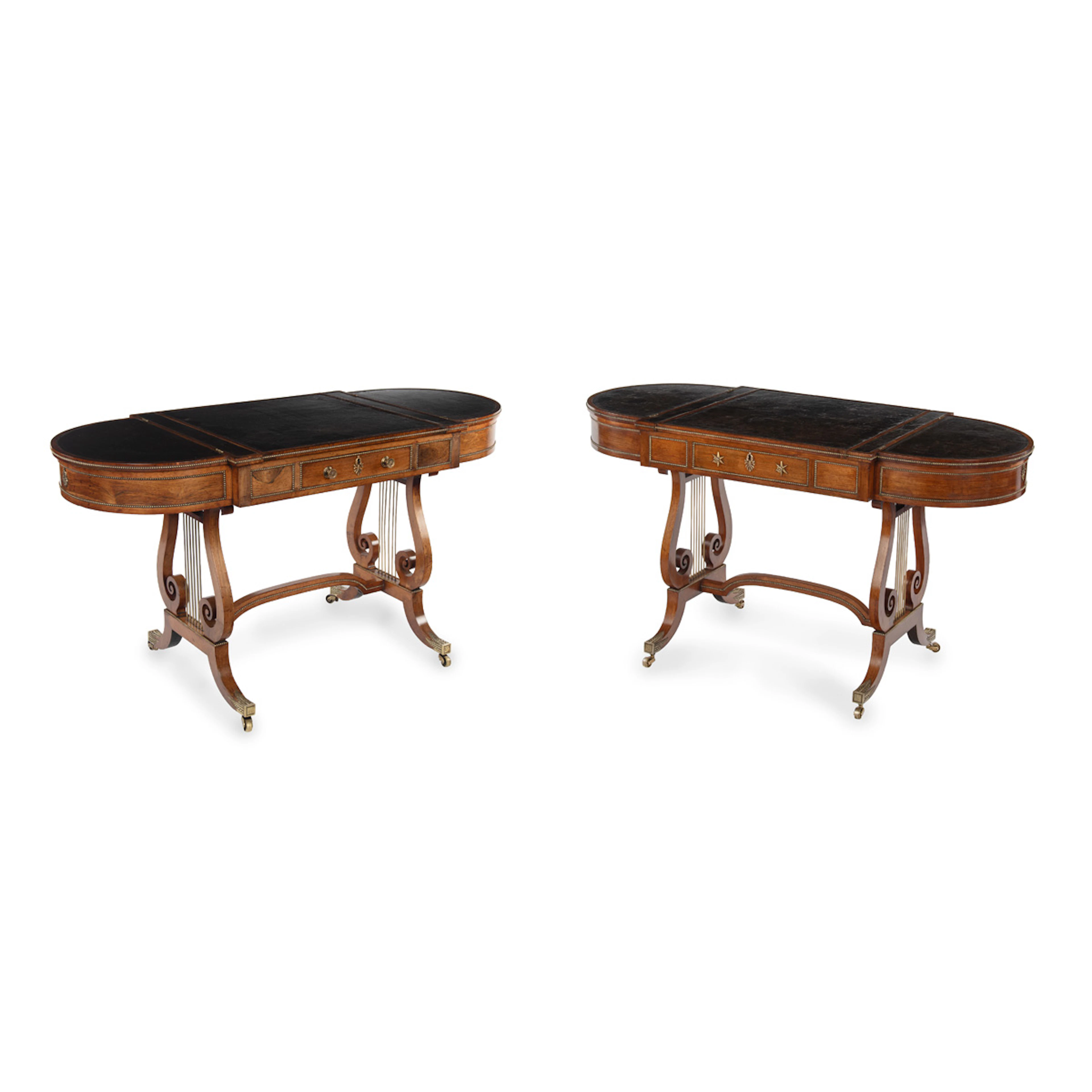 A near pair of Regency period rosewood sofa games tables attributed