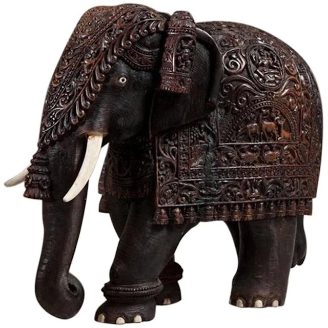 Indian carved hardwood elephant with bone tusks and toe nails