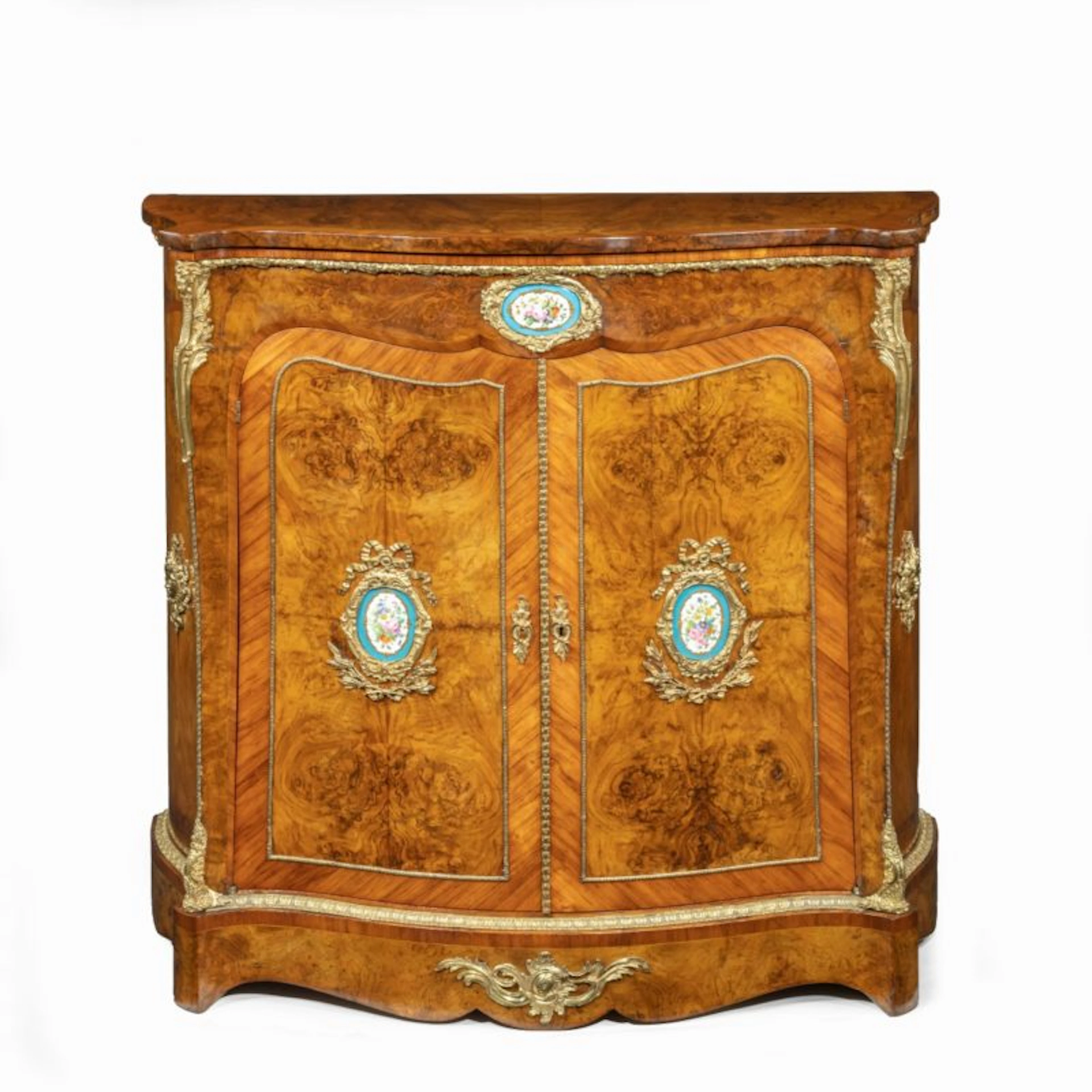 A mid-Victorian kingwood serpentine cabinet