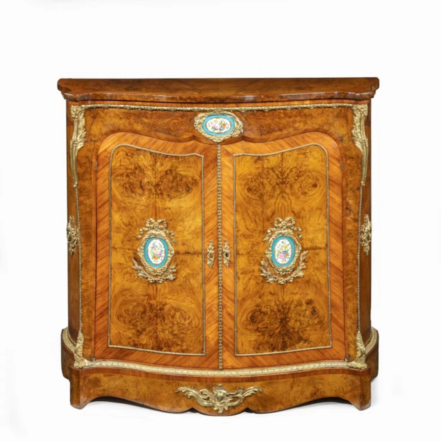 A mid-Victorian kingwood serpentine cabinet