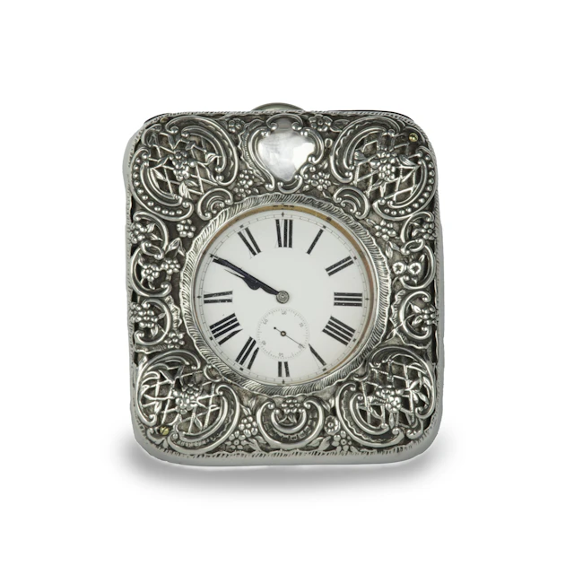 An Edwardian silver watch set into a repousse silver case