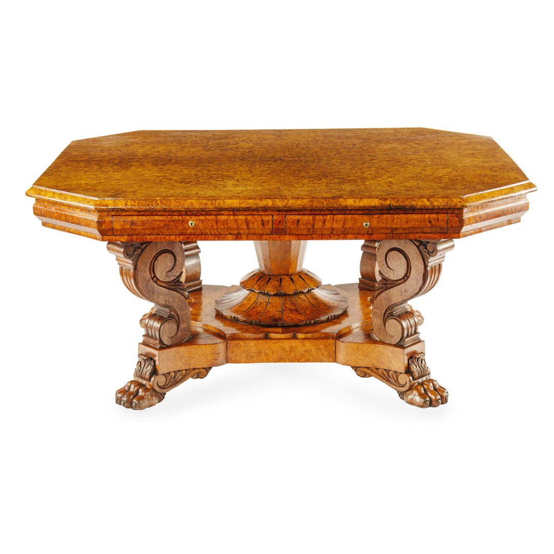 An unusual William IV amboyna and oak four drawer library table by