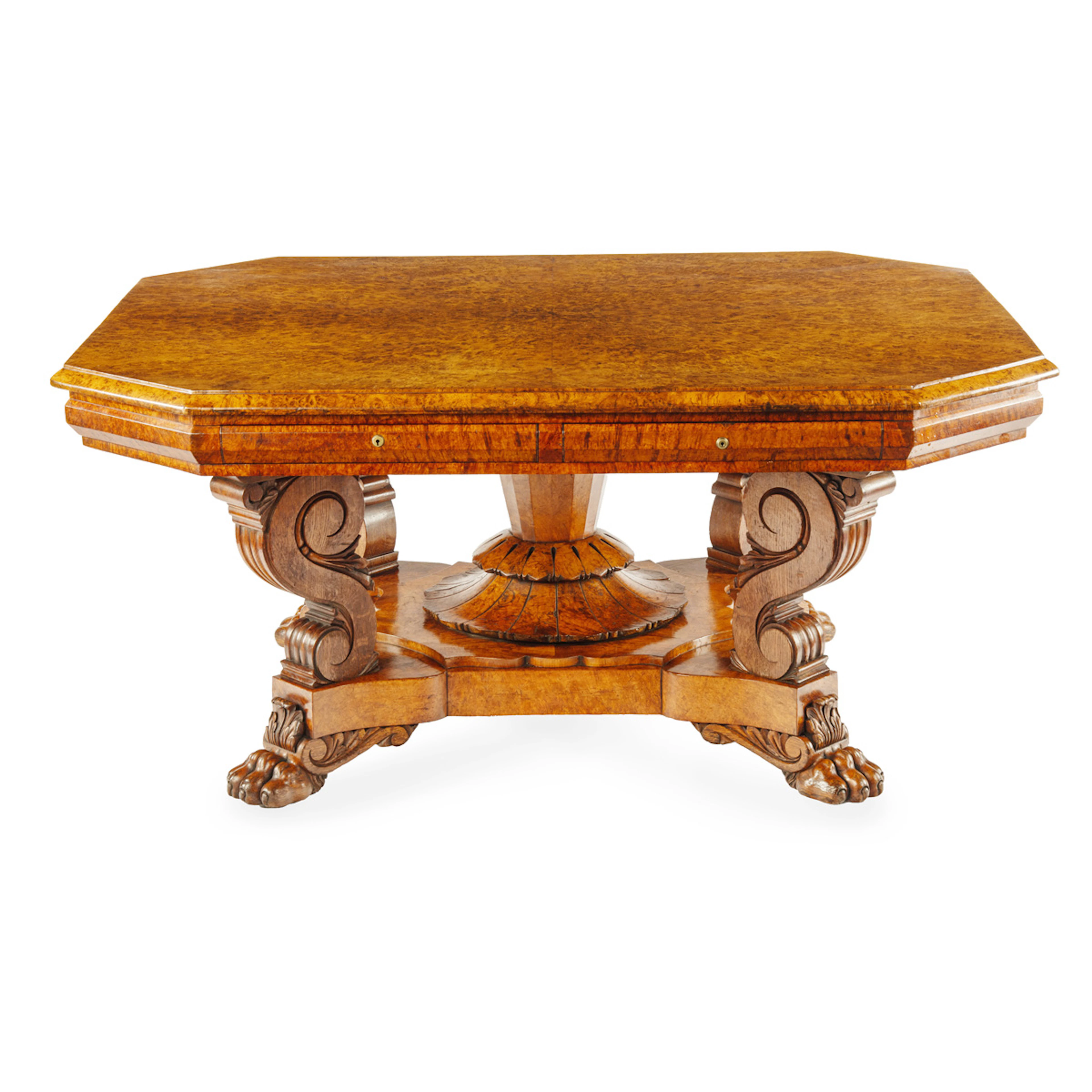 An unusual William IV amboyna and oak four drawer library table by