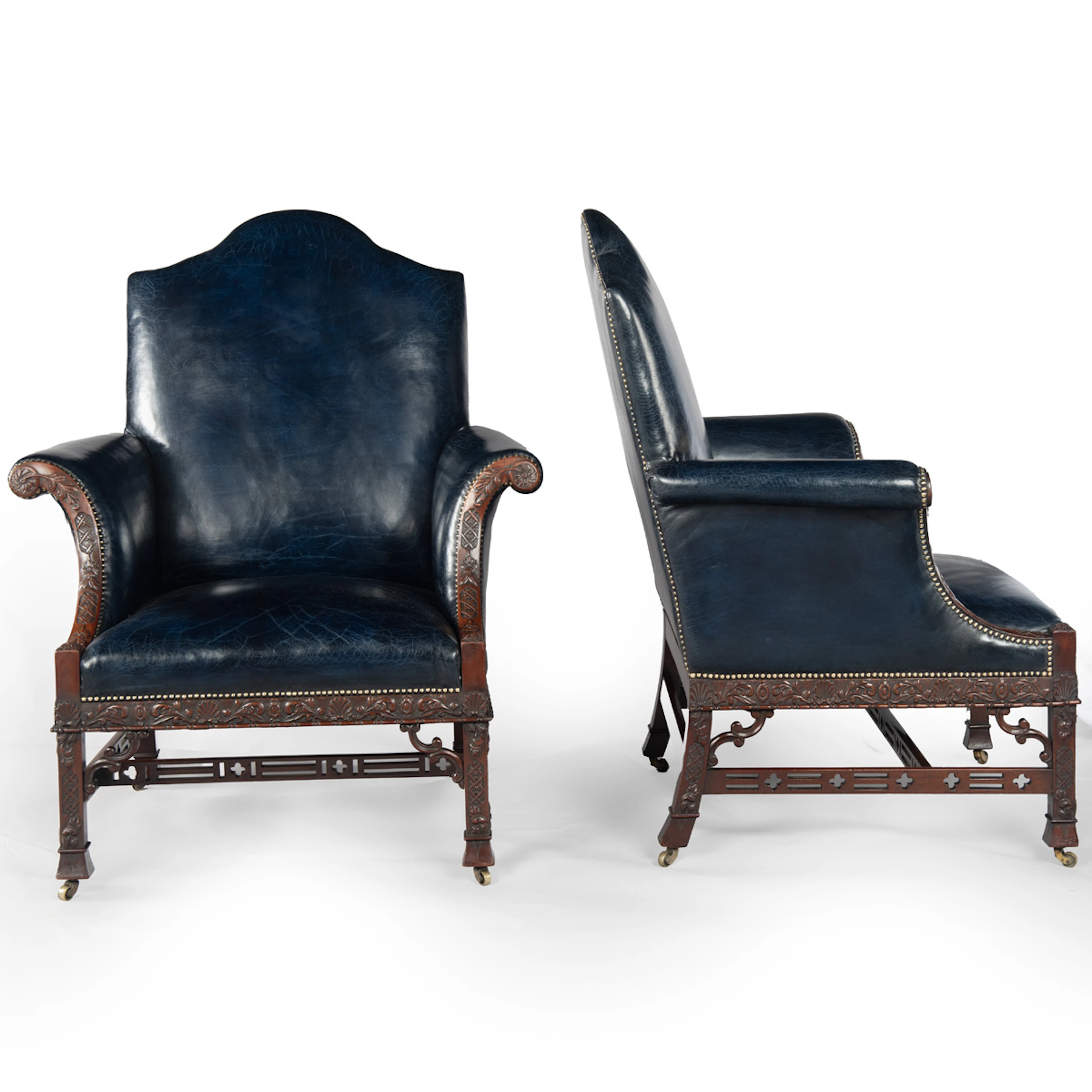 A Fine Matched Pair of large mahogany Carved Wing Chairs Based on