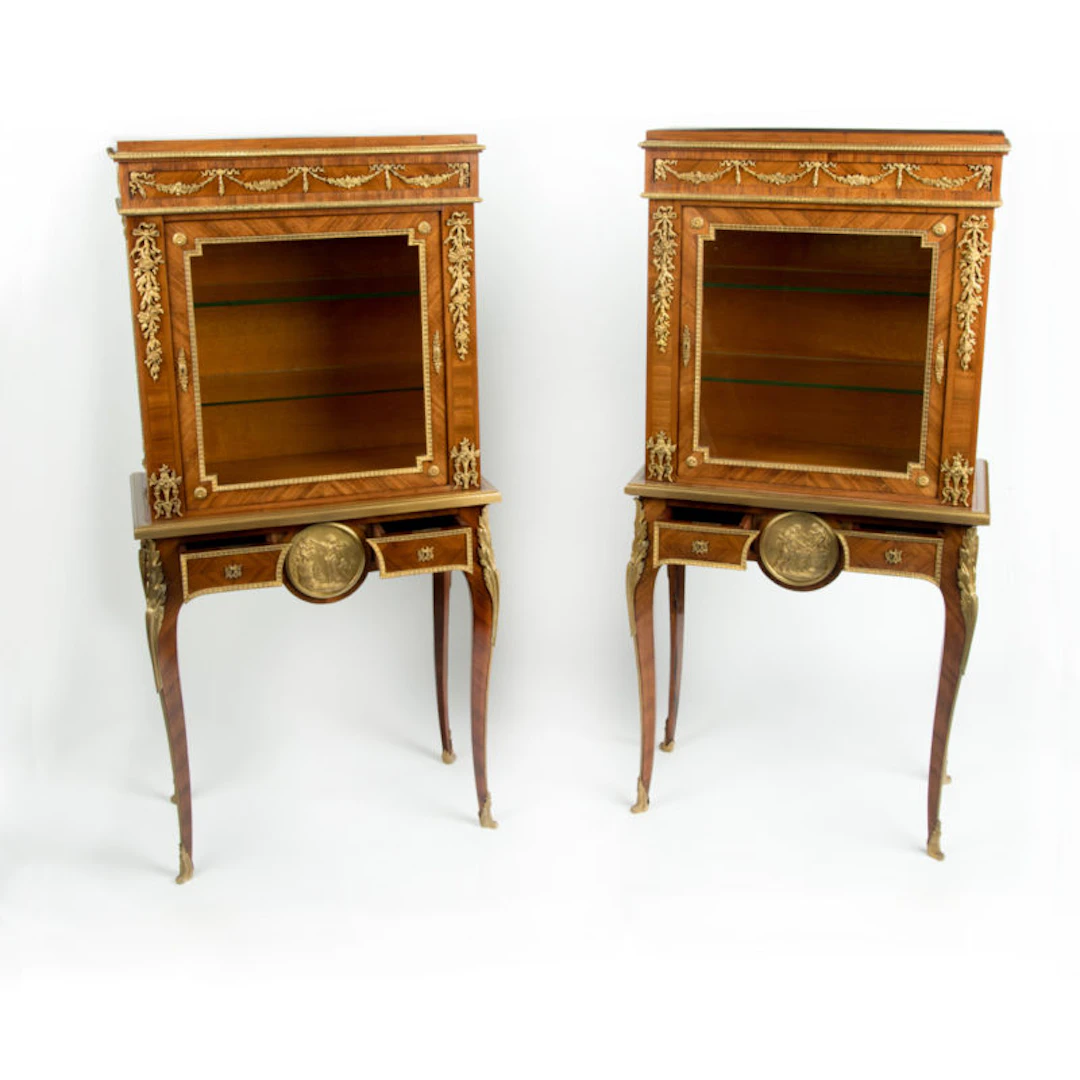 A pair of small Napoleon III kingwood display cabinets on stands