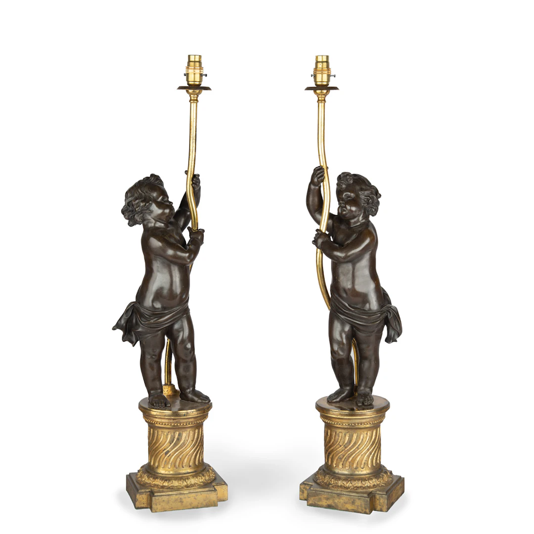 A pair of Napoleon III bronze and ormolu table lamps