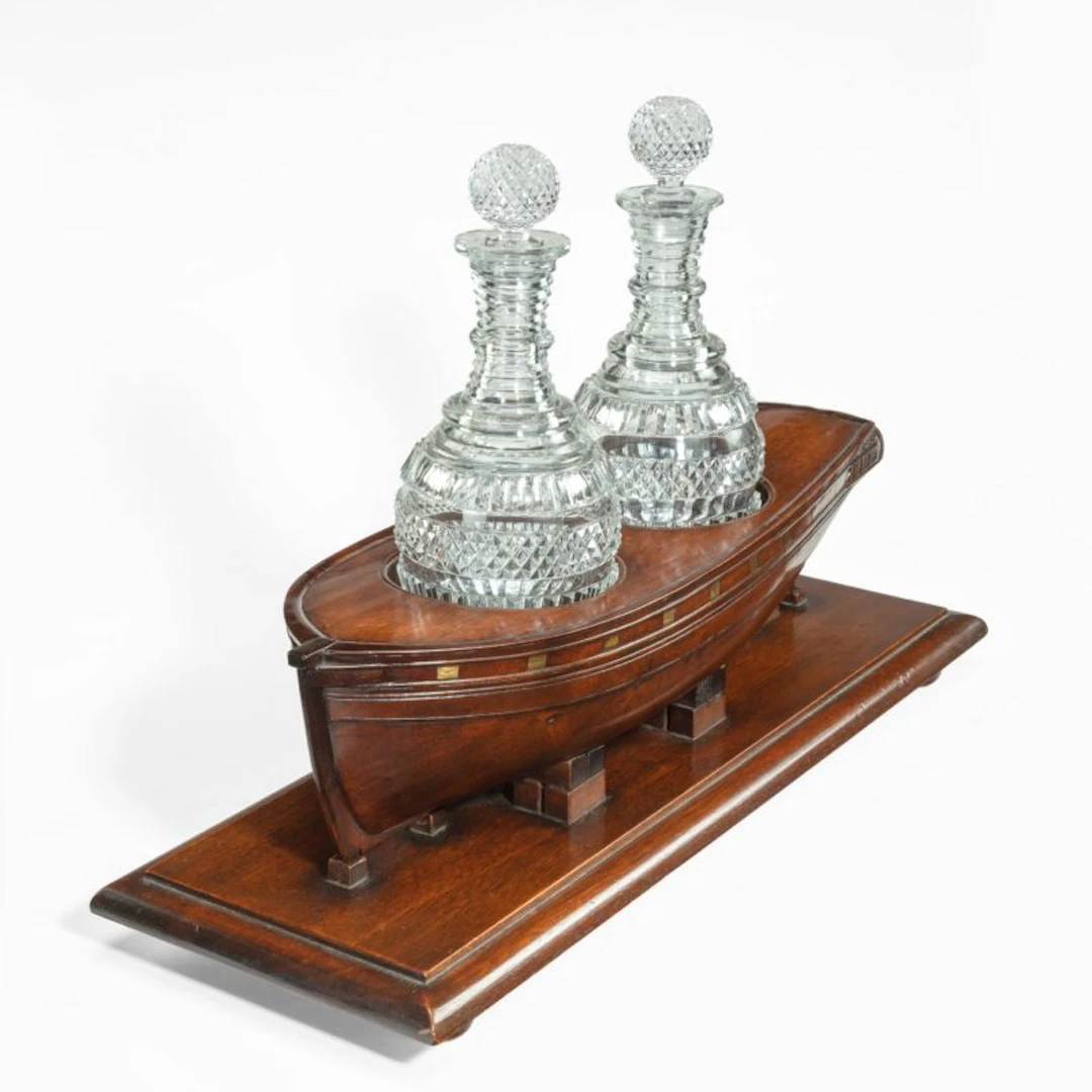 A rare late Georgian mahogany novelty decanter stand