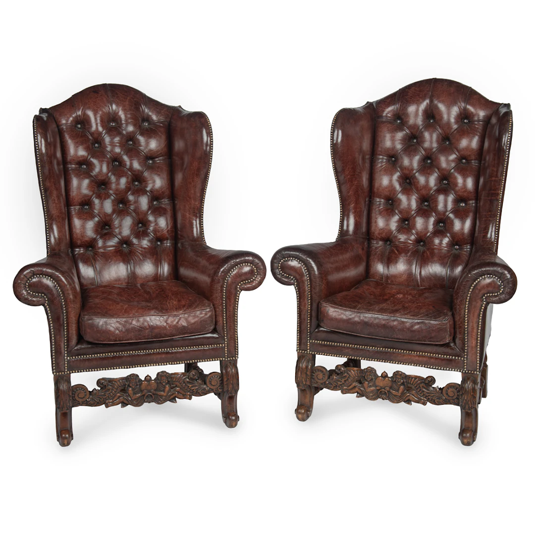 A Fine Pair of 1920s Walnut and Leather Wing Chairs in the Late Baroque