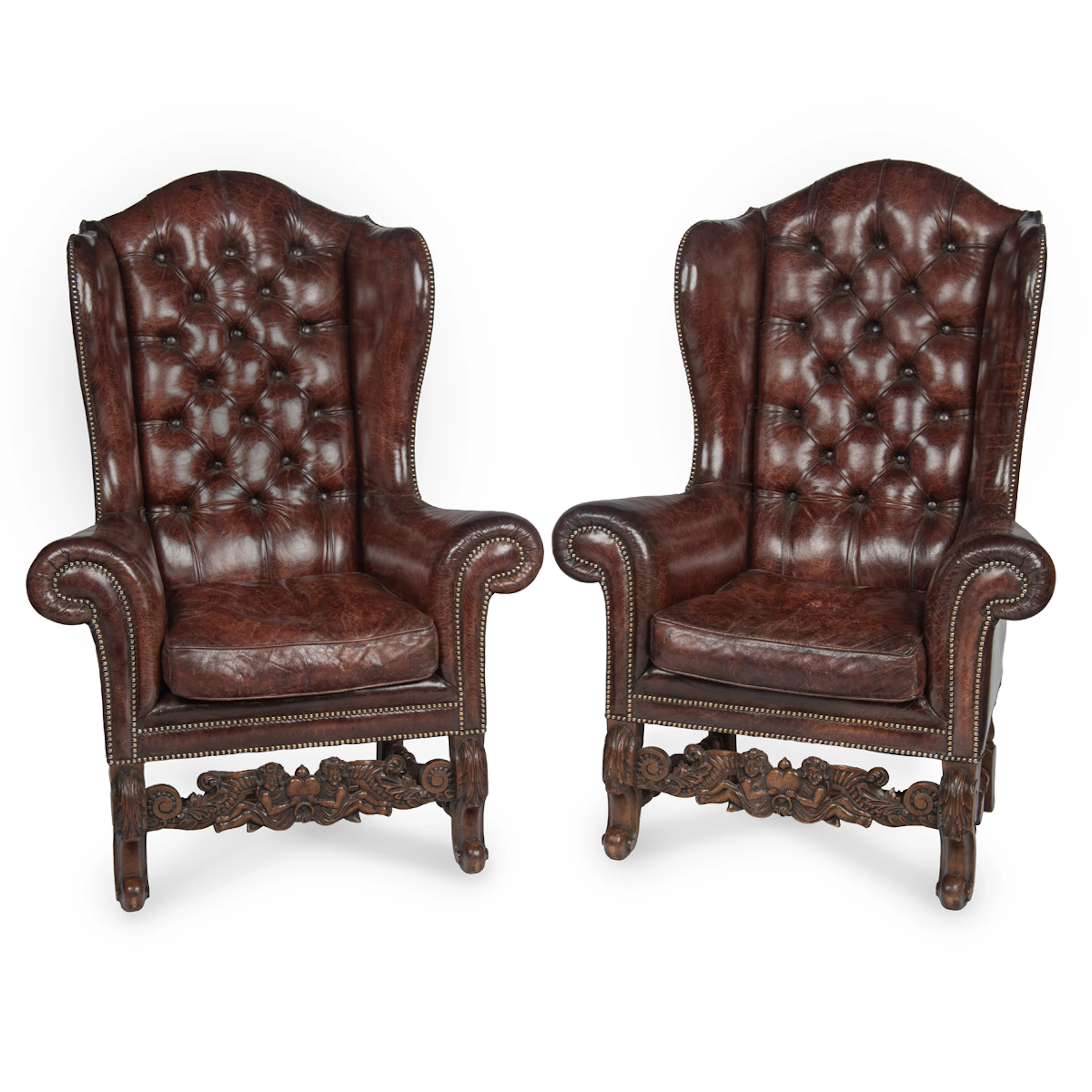 A Fine Pair of 1920s Walnut and Leather Wing Chairs in the Late Baroque
