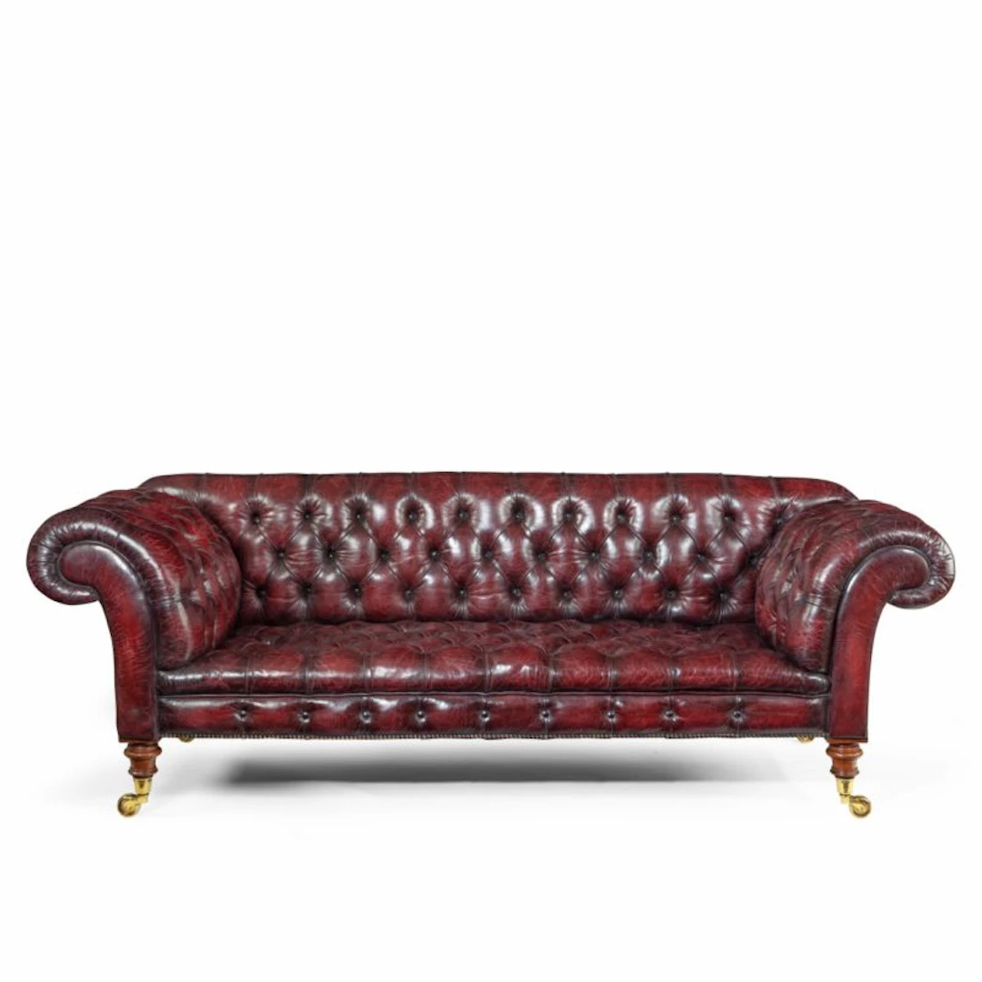 A Victorian deep buttoned Chesterfield settee