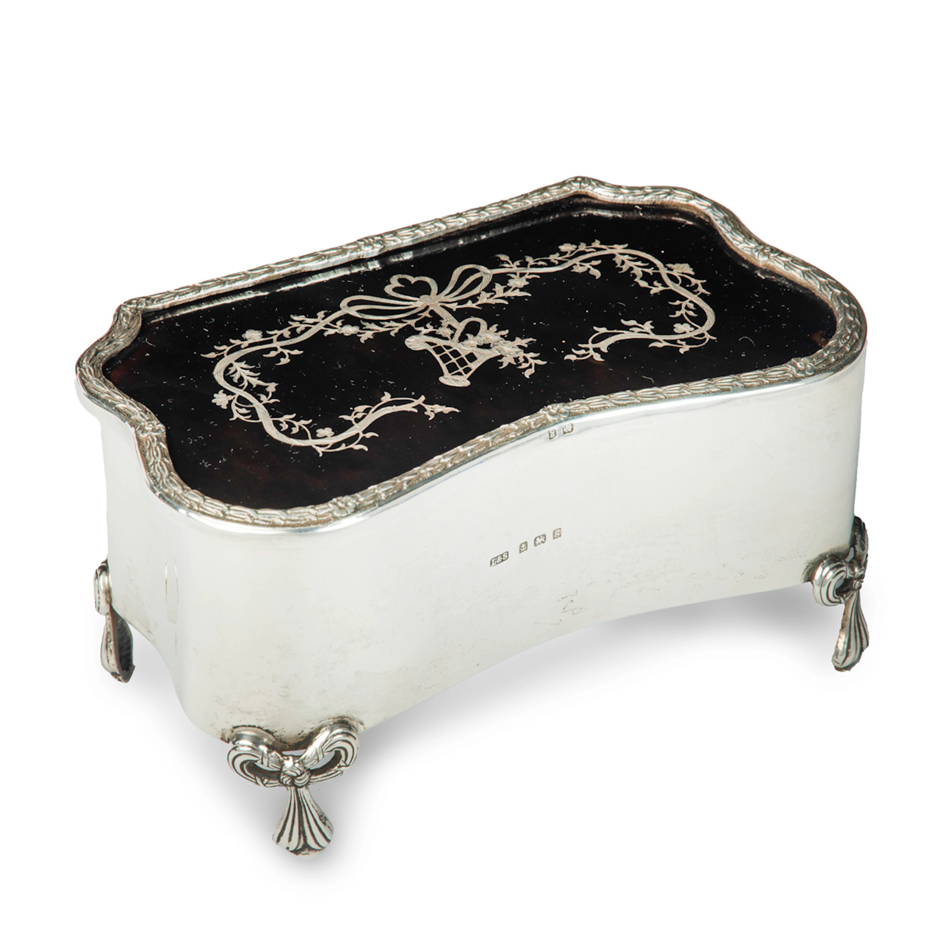 A large Edwardian shaped rectangular silver and tortoiseshell piqué box