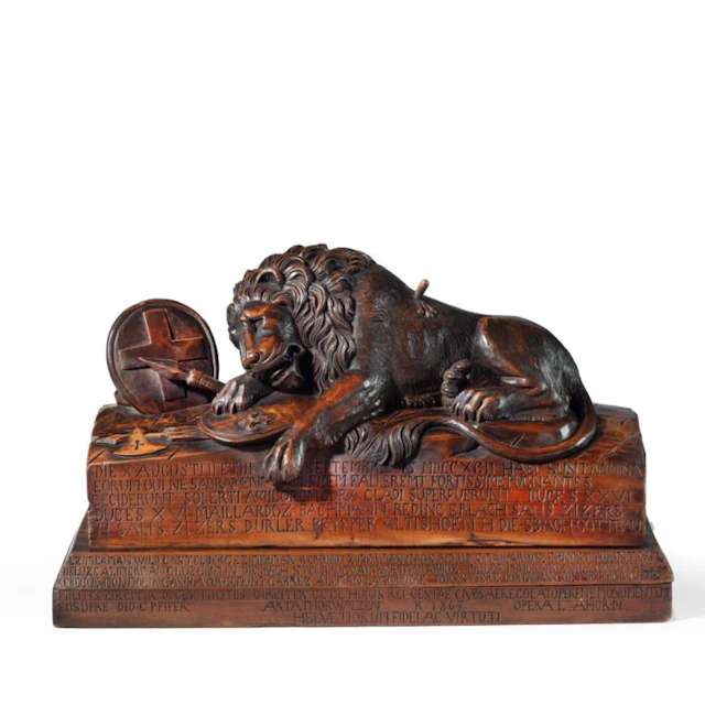 A large Black Forest model of the Lion of Lucerne dated 1867, after