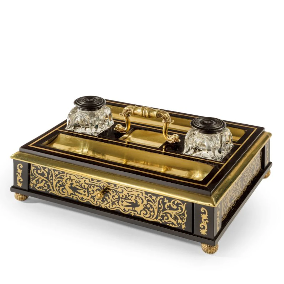 A Regency brass-inlaid ebony desk compendium