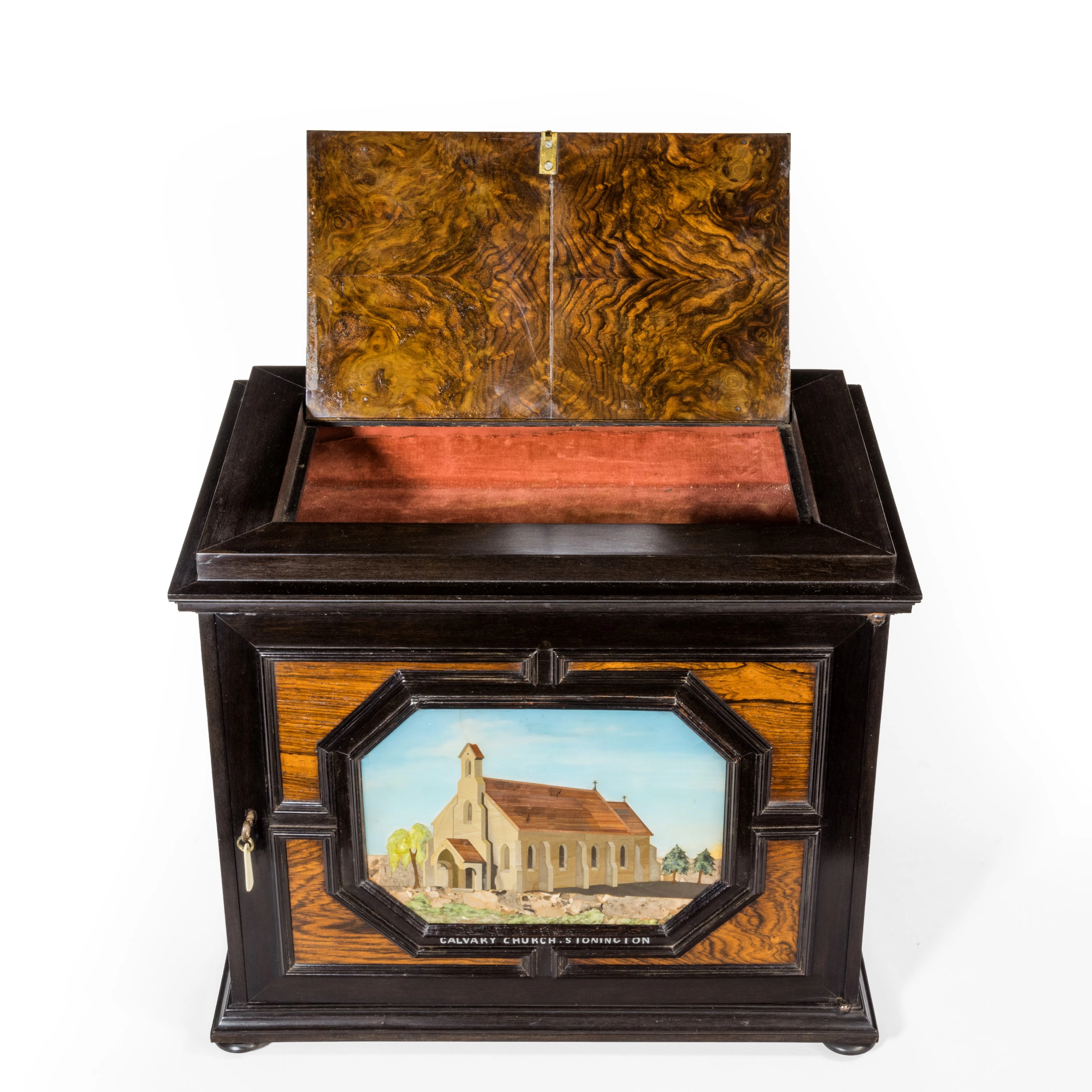 An unusual ebony bijouterie table cabinet showing Calvary Church