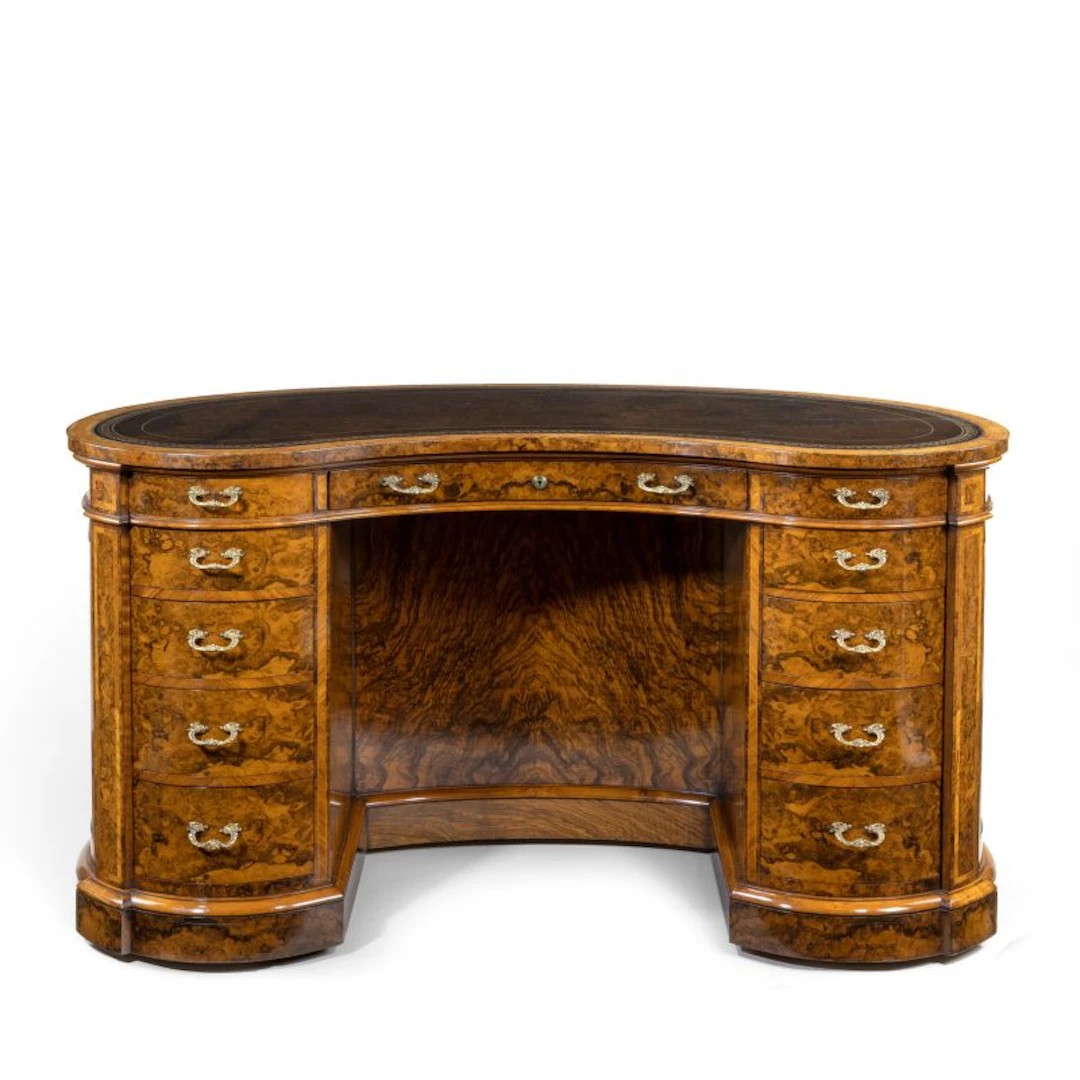 Victorian kidney-shaped desk in richly figured burr walnut by Gillows