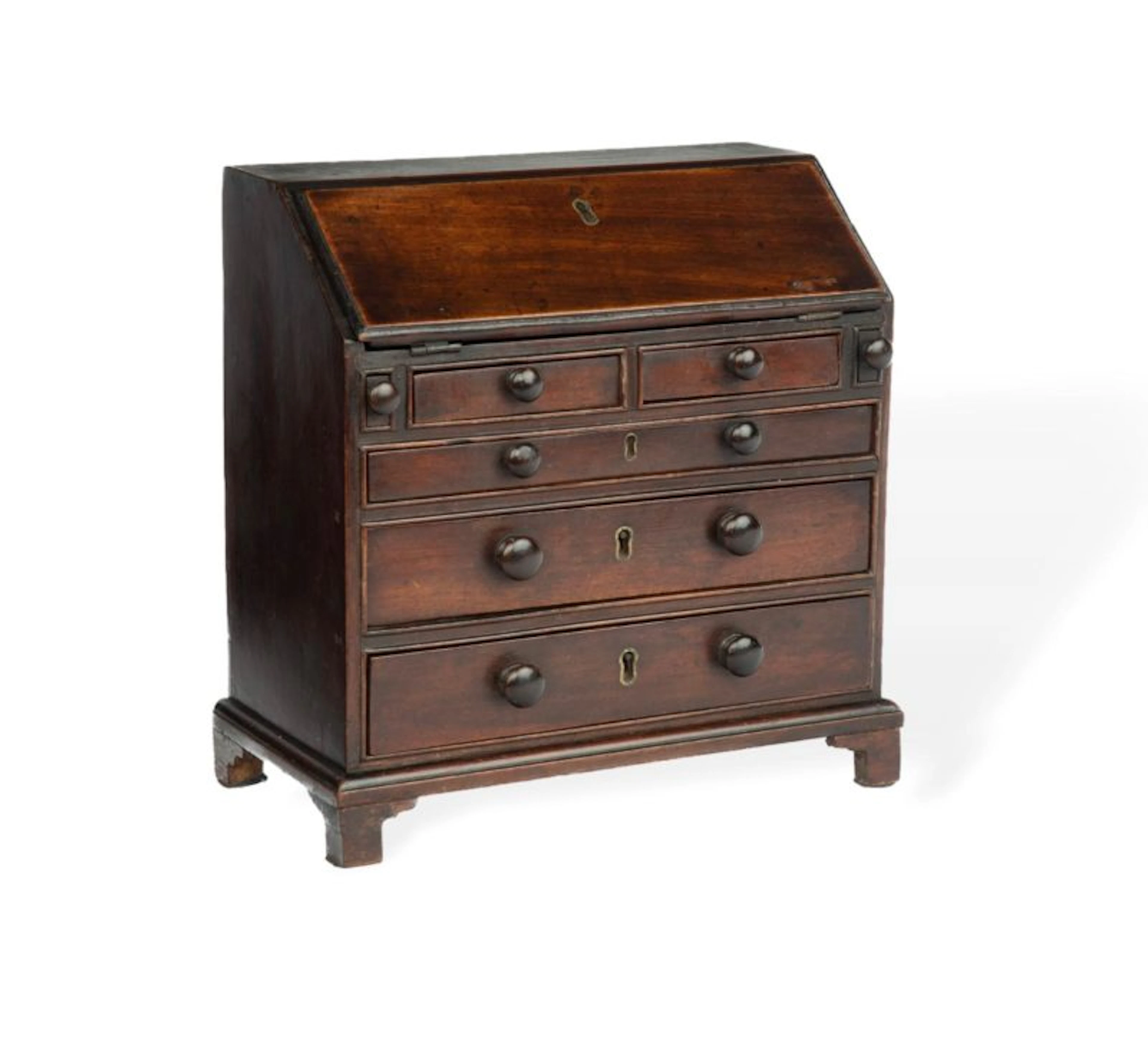 A miniature George III mahogany bureau