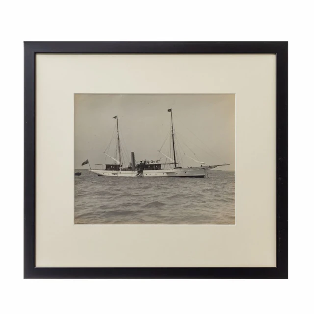 A gelatin print of a beautiful gentleman steam yacht at anchor by W Kirk
