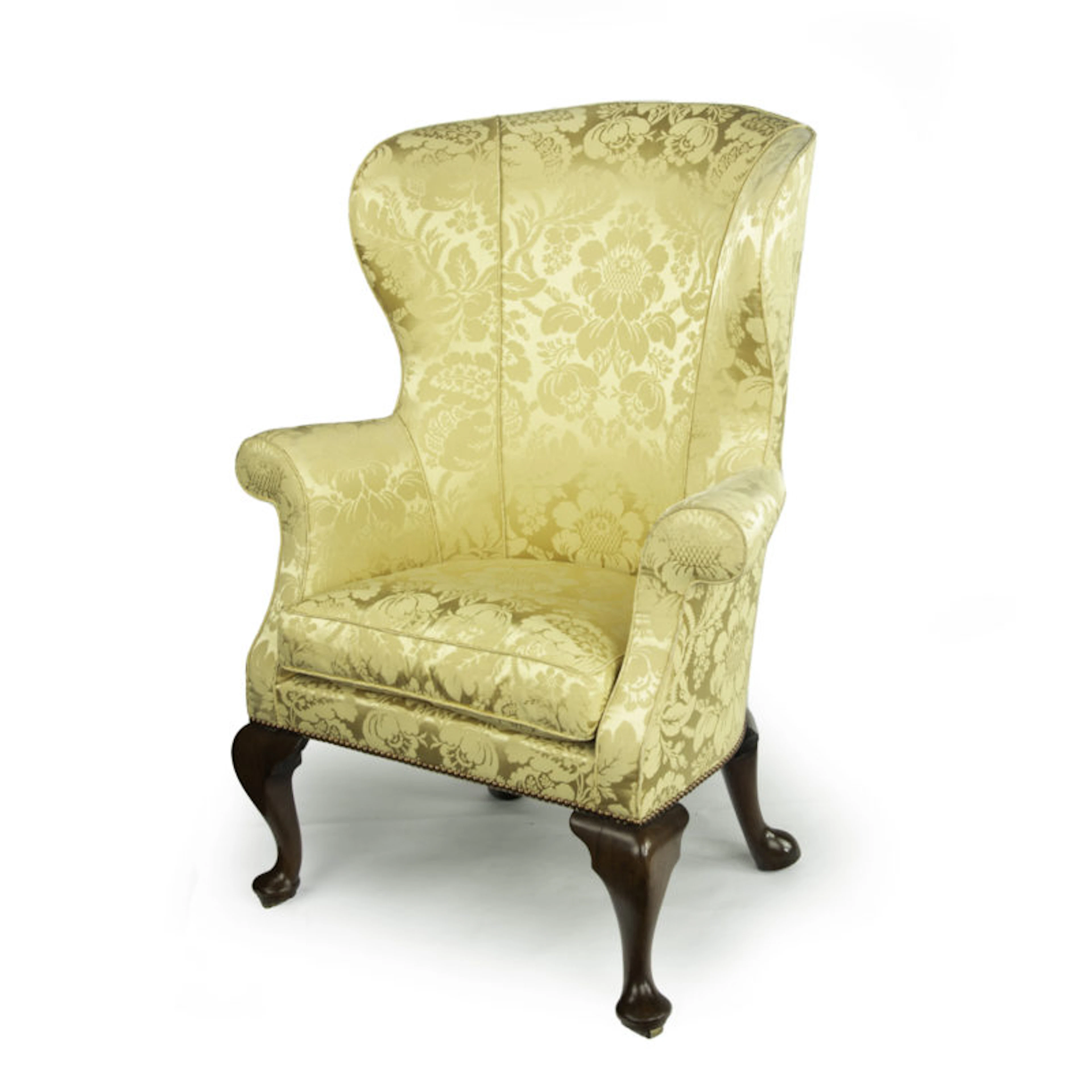 An elegant George I walnut wing armchair