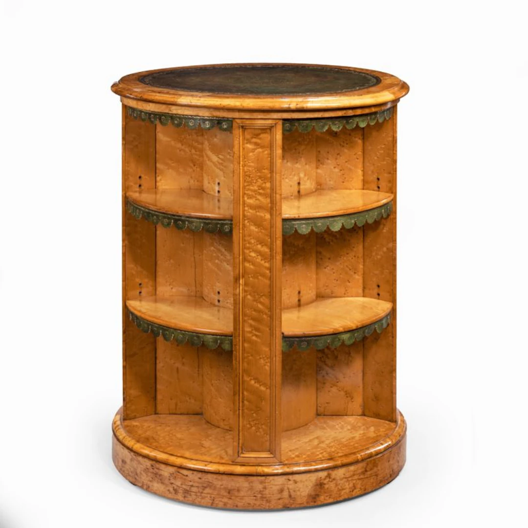 A late Regency bird’s eye-maple cylindrical open bookcase attributed to Gillows