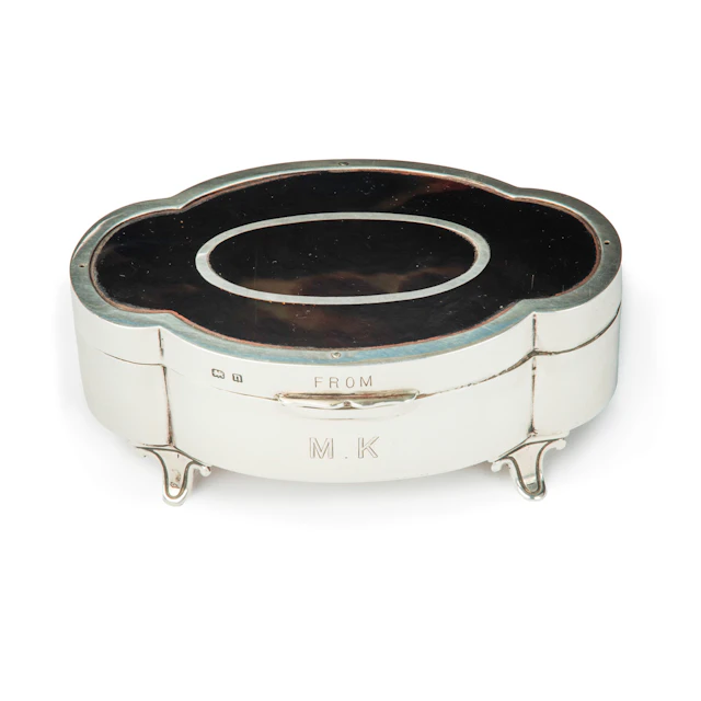 A small lobed oval tortoiseshell piqué patch pot by Mappin and Webb