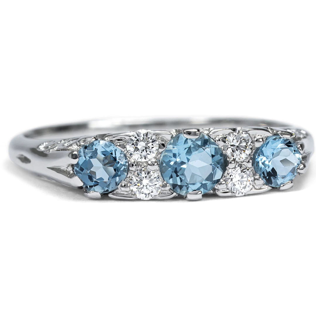 Unworn platinum ring with aquamarines & diamonds from our workshop