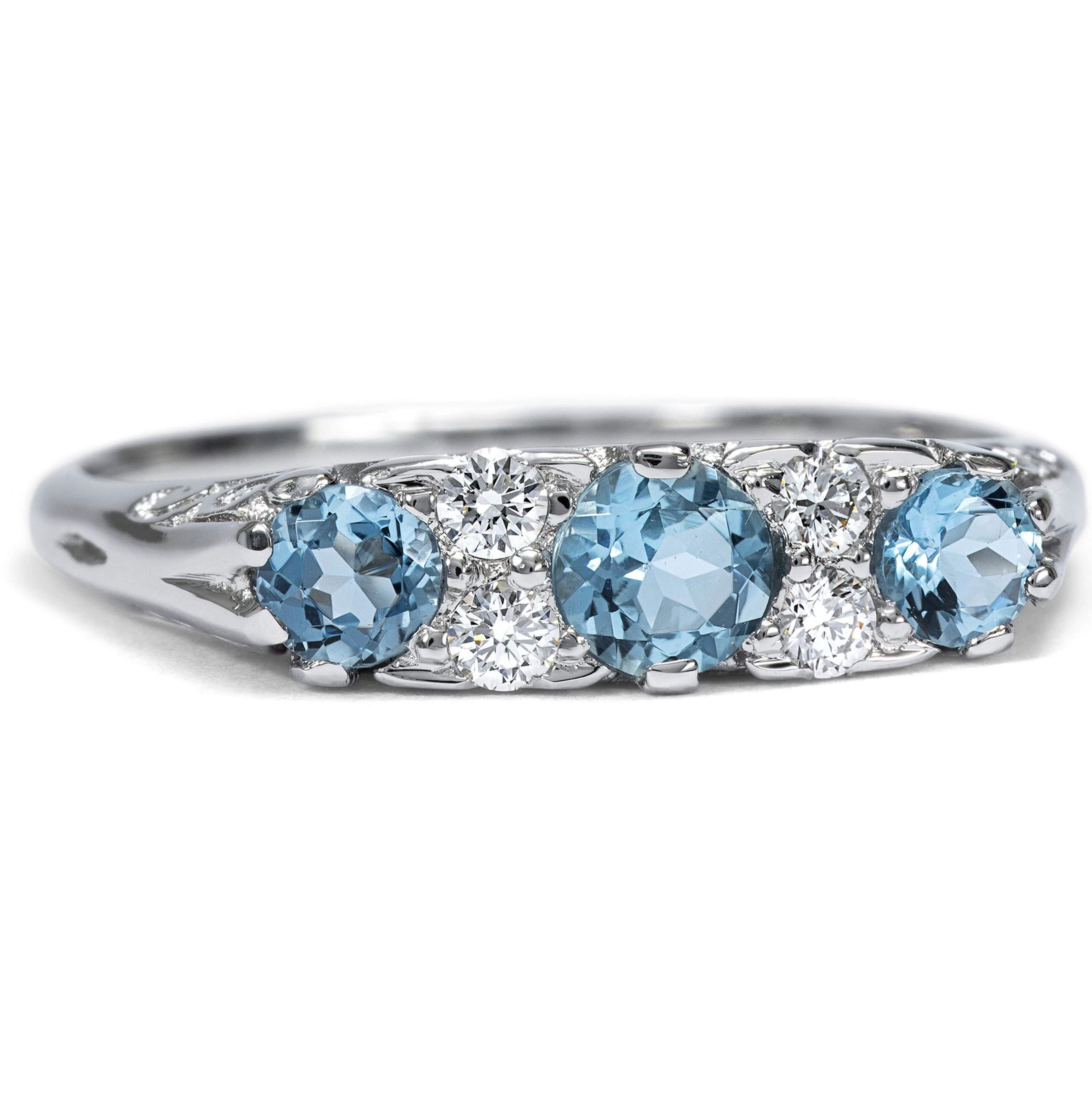 Unworn platinum ring with aquamarines & diamonds from our workshop