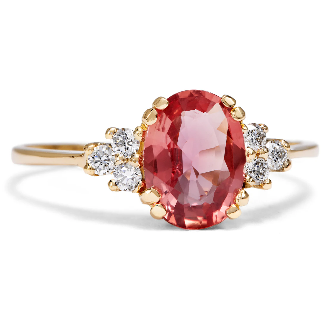 Delicate Ring with a Pink-Orange Sapphire and Diamonds in Gold, from