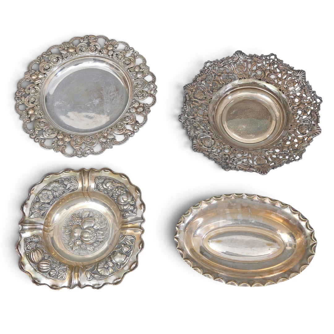 Four silvery metal trays, 20th Century.