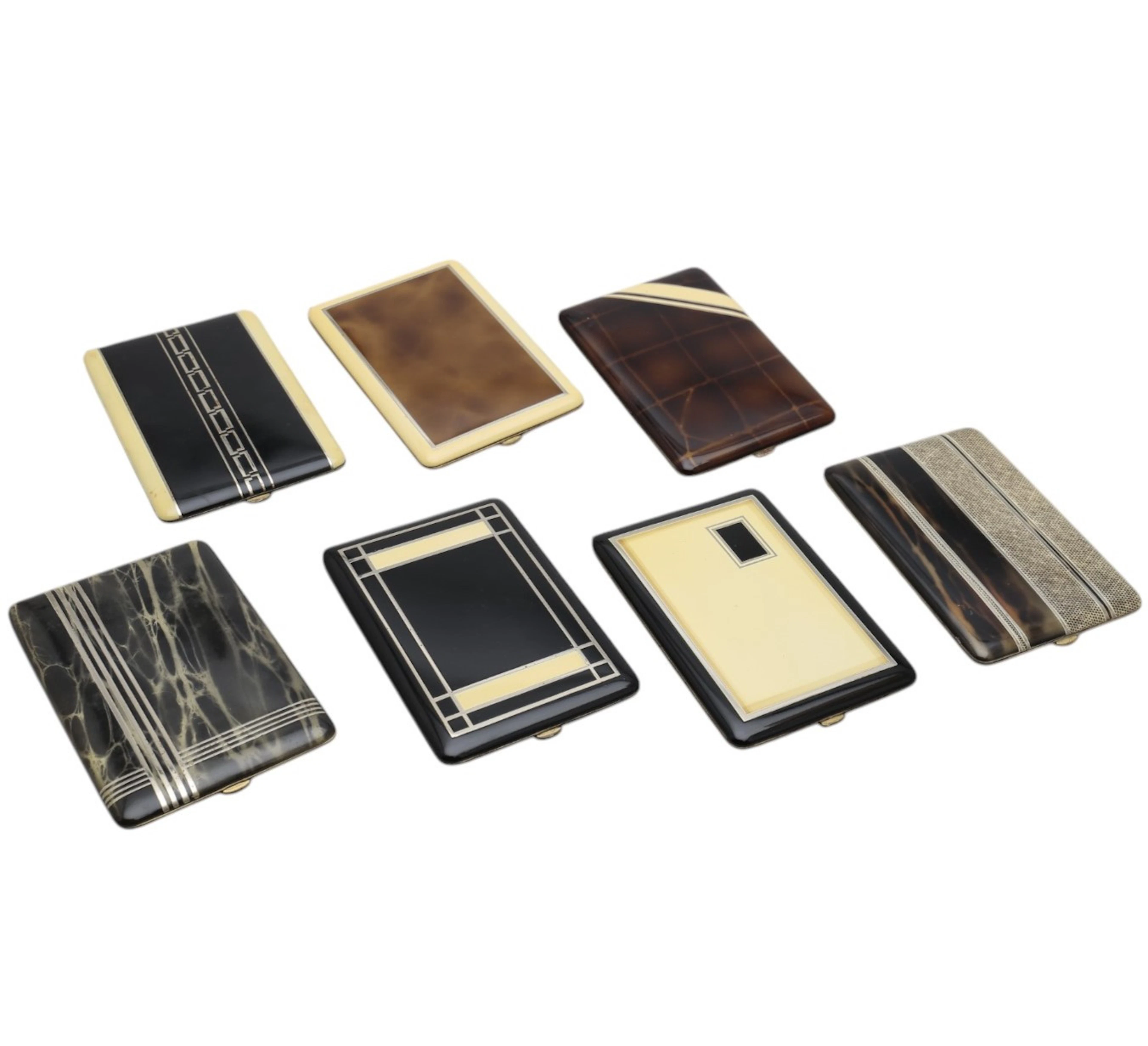 Seven cigarette cases in lacquered metal, circa 1930-1940.