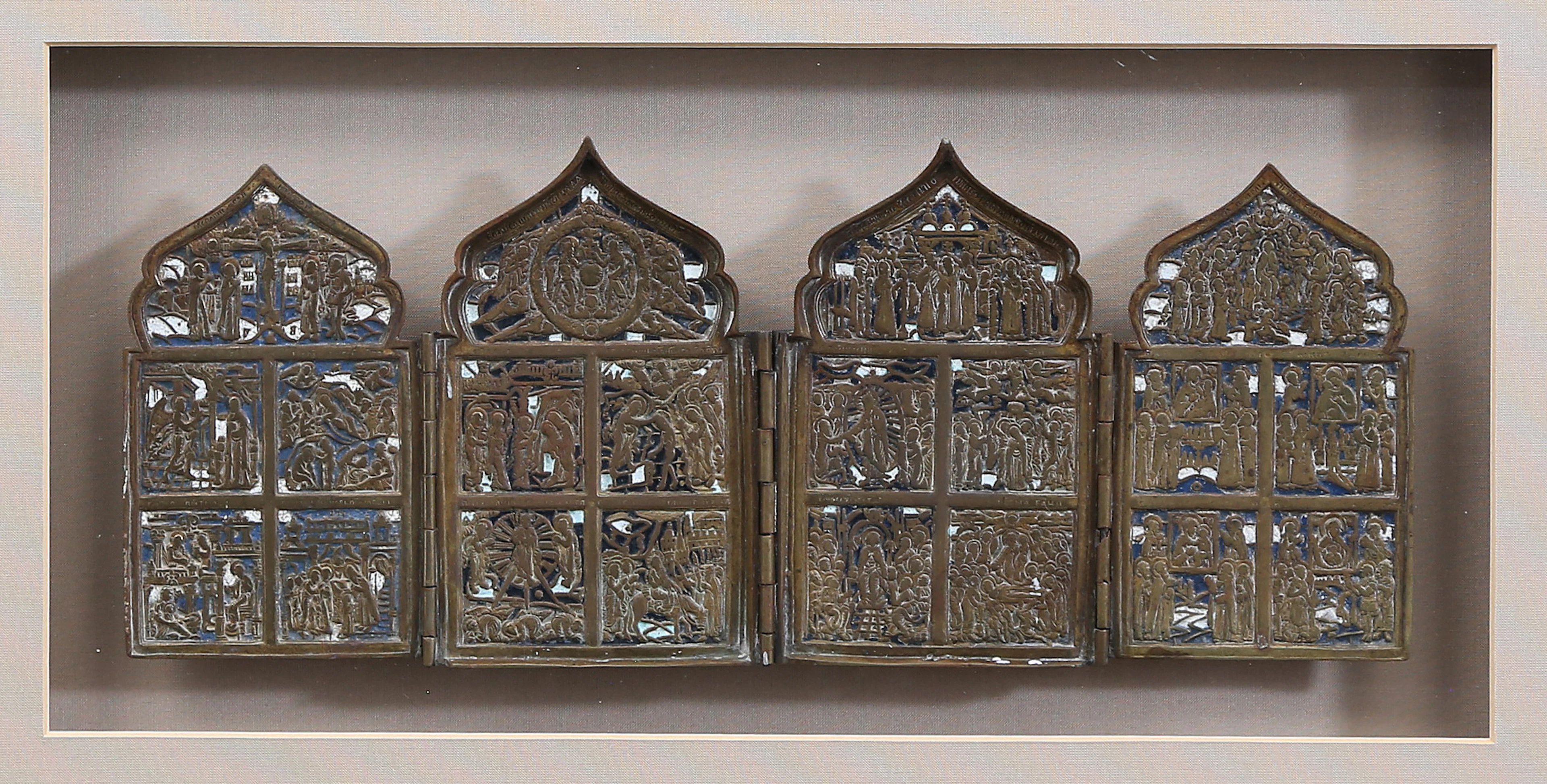 Russian four-part icon in enamelled bronze, late 19th Century.