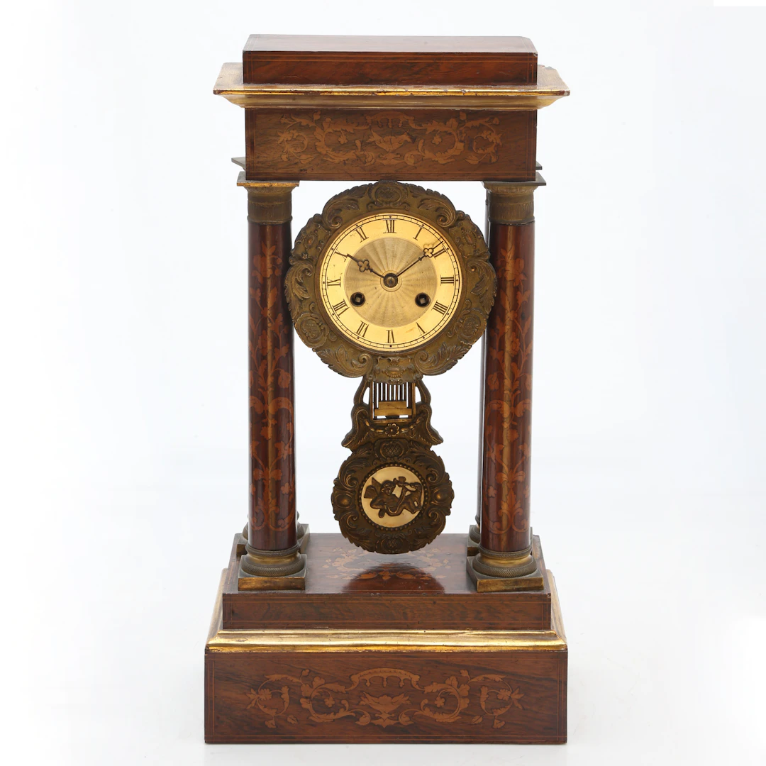 Louis Philippe portico clock in mahogany with marquetry, circa 1850.