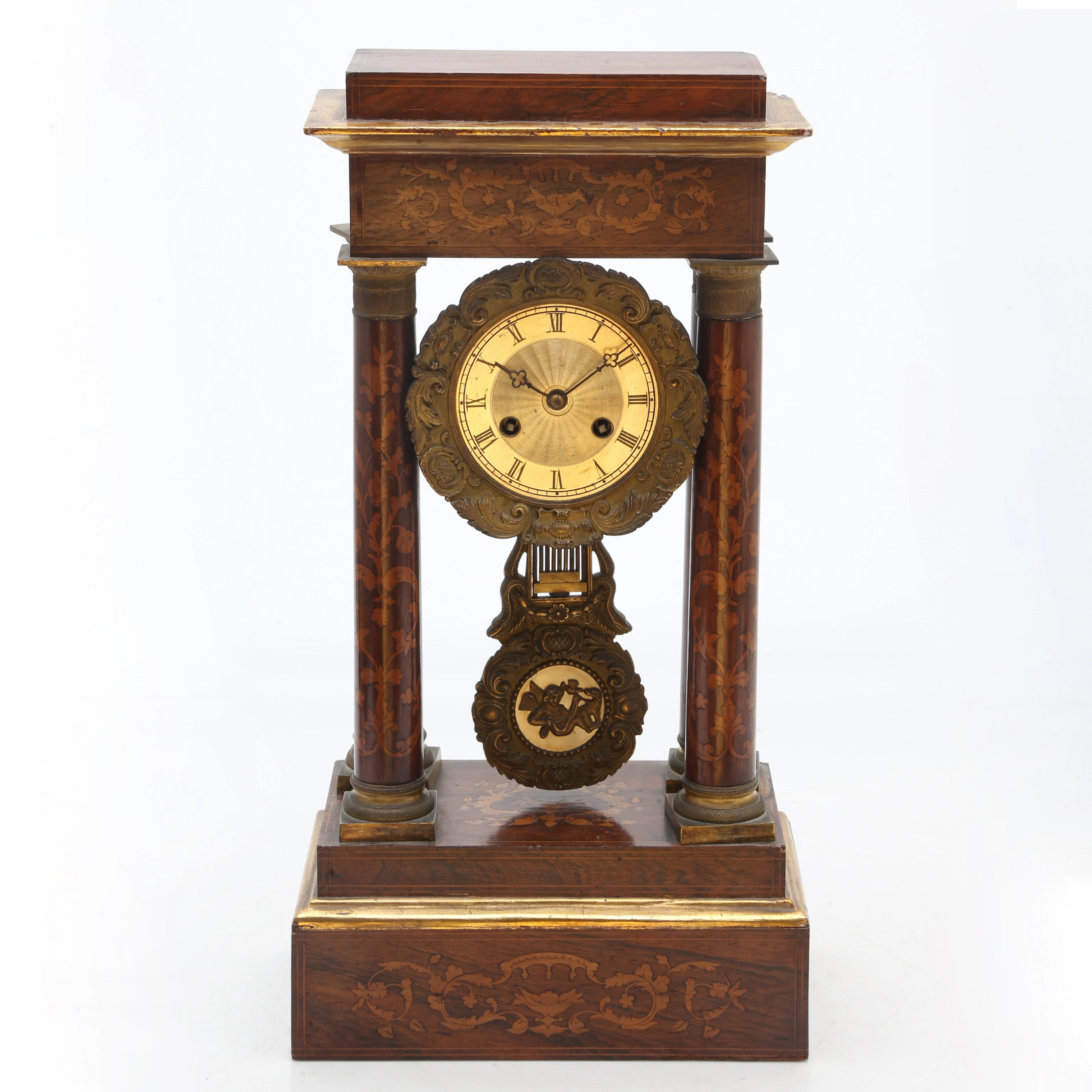 Louis Philippe portico clock in mahogany with marquetry, circa 1850.
