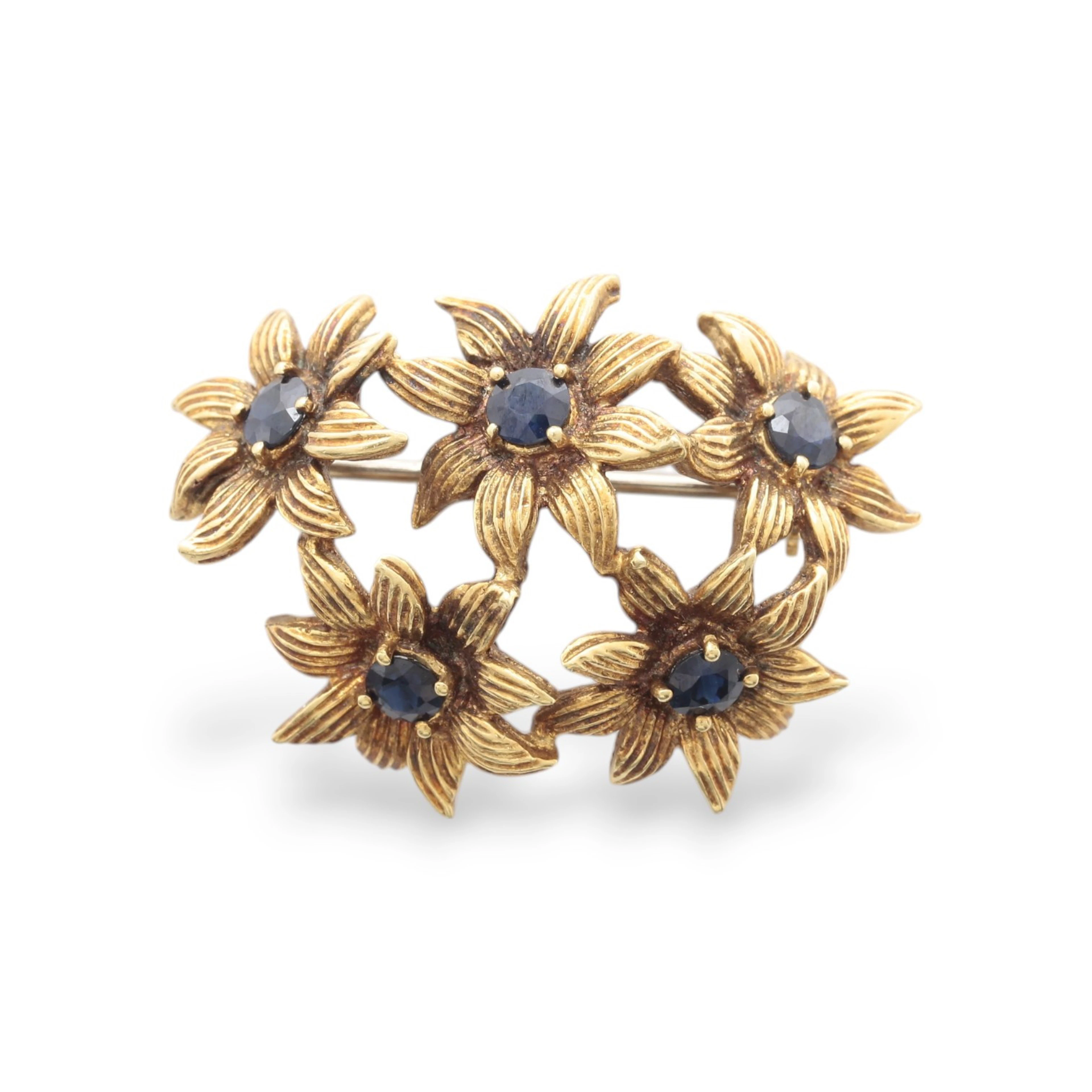 TIFFANY & CO. Gold and sapphires floral brooch, circa 1970.