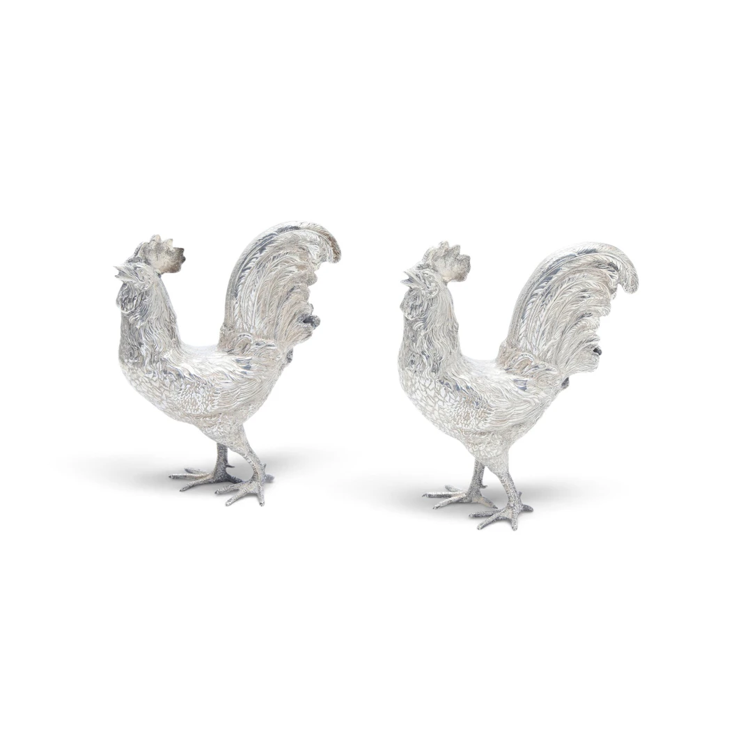 Pair of silvery metal roosters, 20th Century.