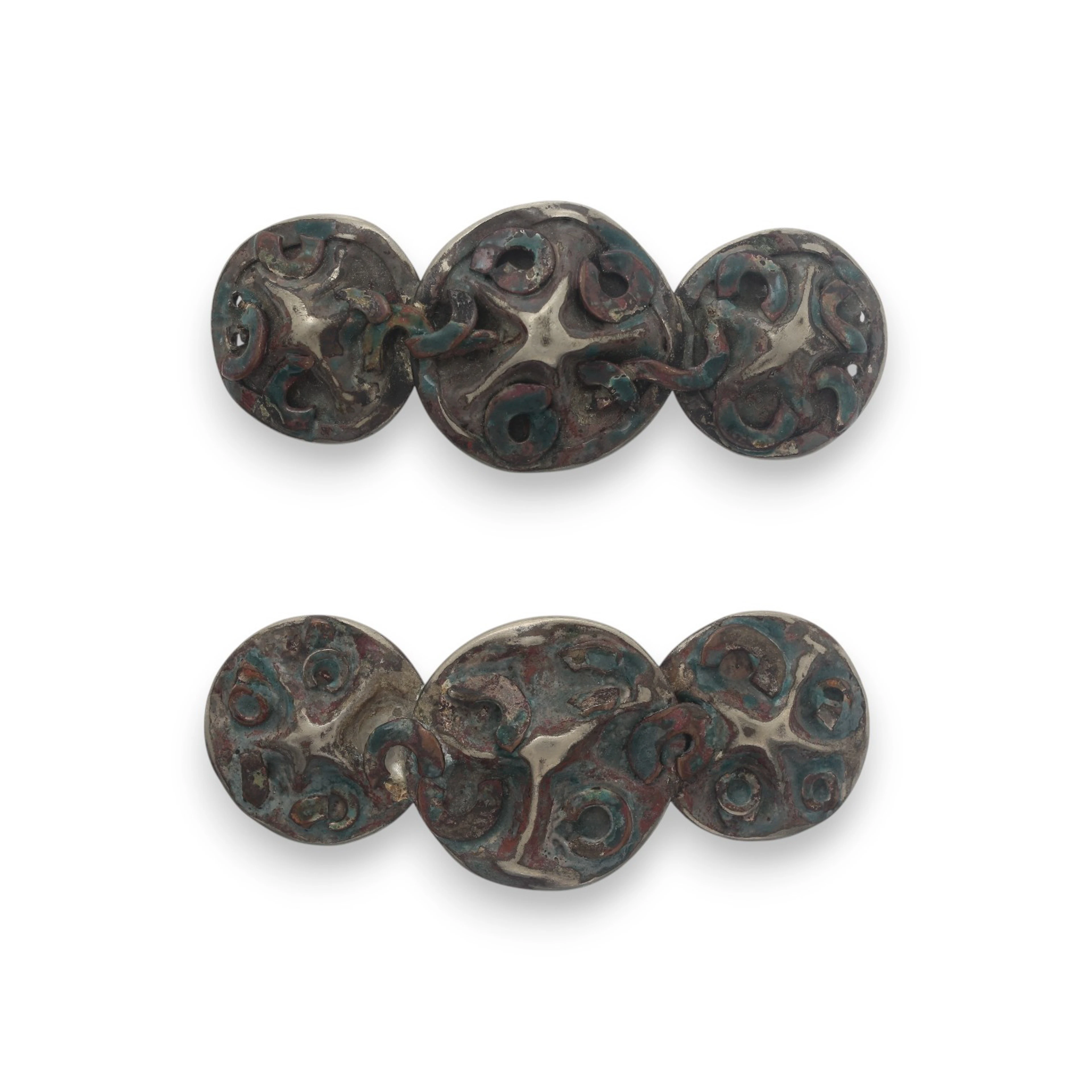 JULIO GONZÁLEZ. Pair of brooches, circa 1920.