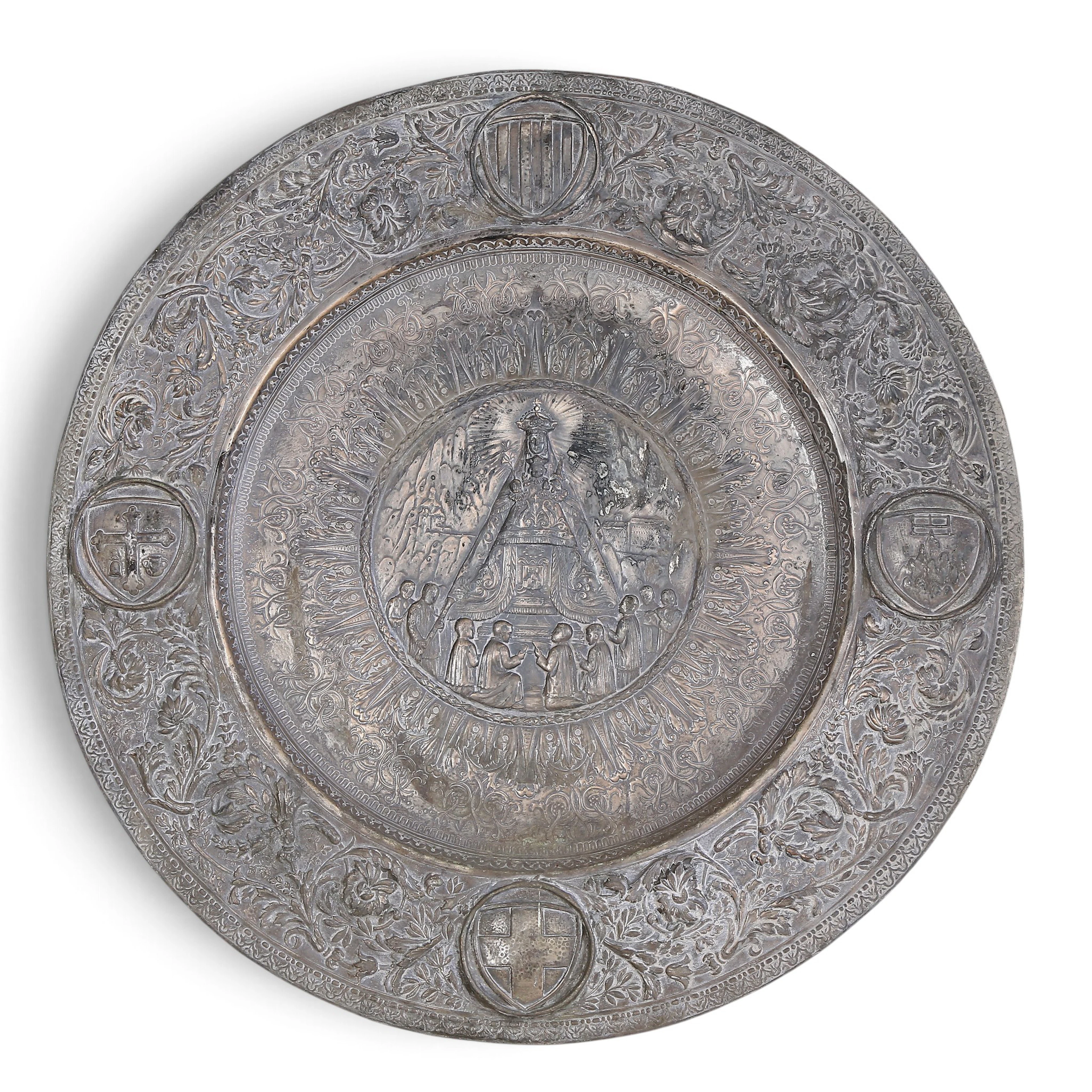 Ornamental silvery copper platter depicting Our Lady of Montserrat