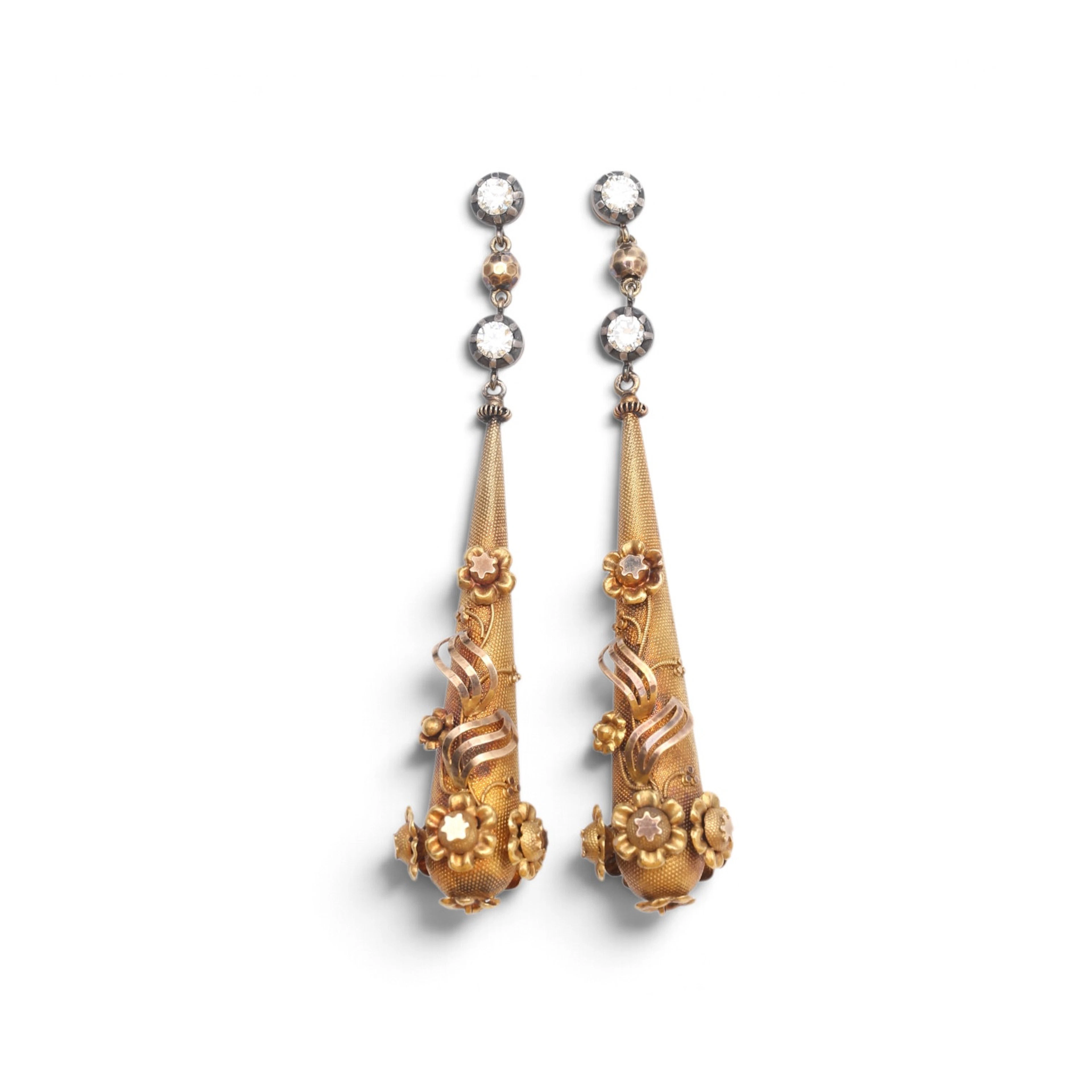 Diamonds and gold floral long earrings, circa 1830.