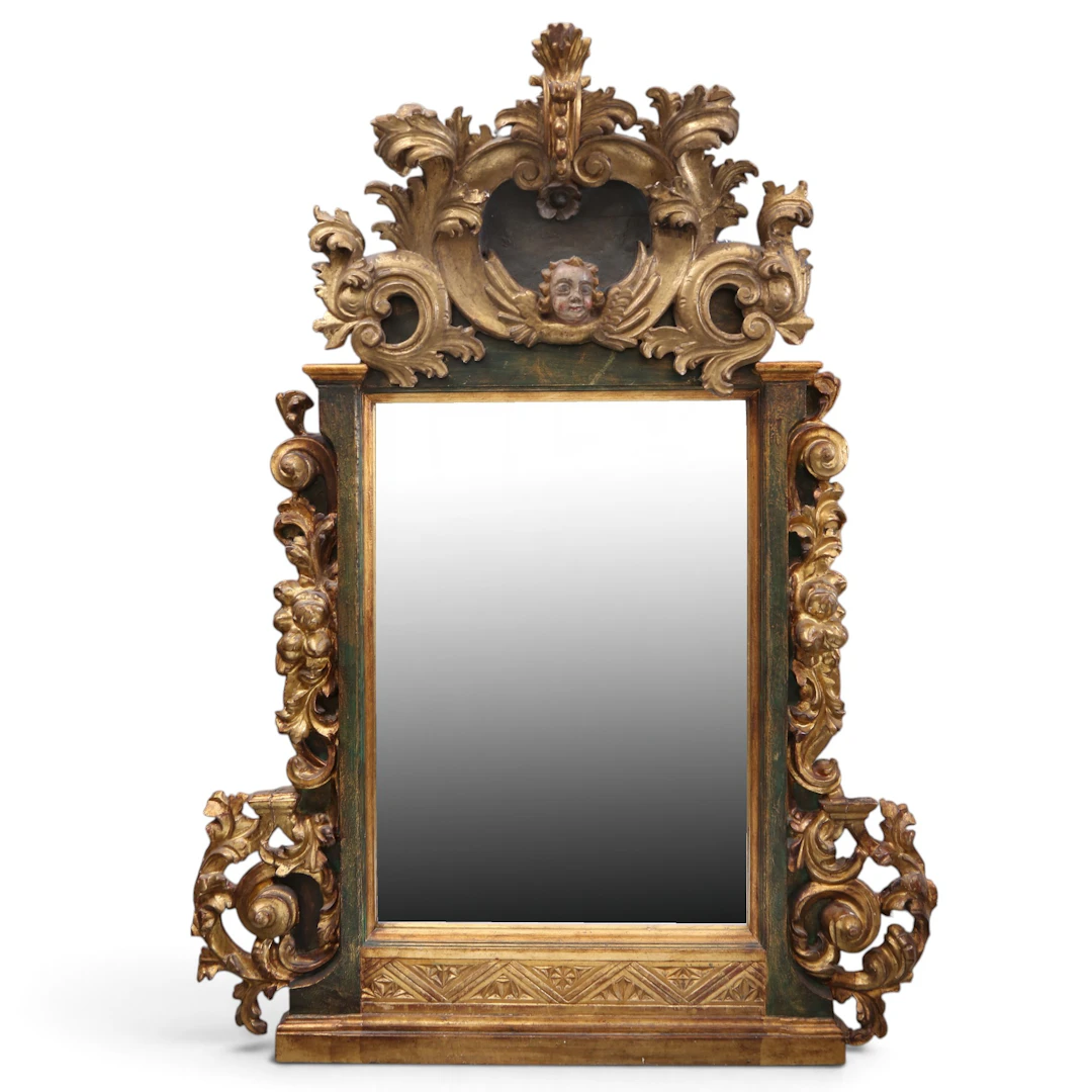 Mirror with Baroque carved, polychromed and gilded wood frame, 18th century.