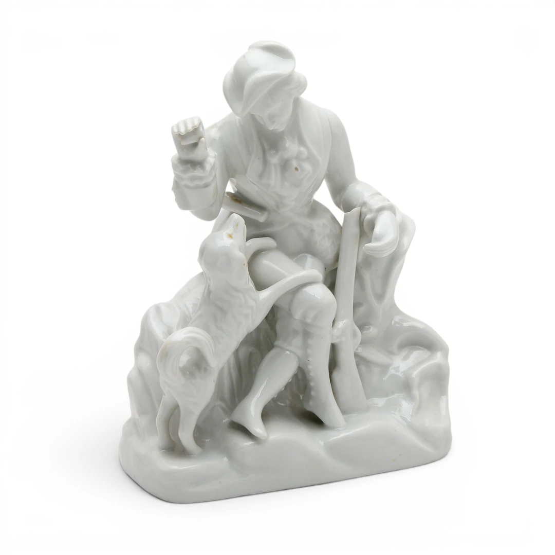"Hunter with a dog", glazed porcelain figure by Santa Clara, 20th Century.