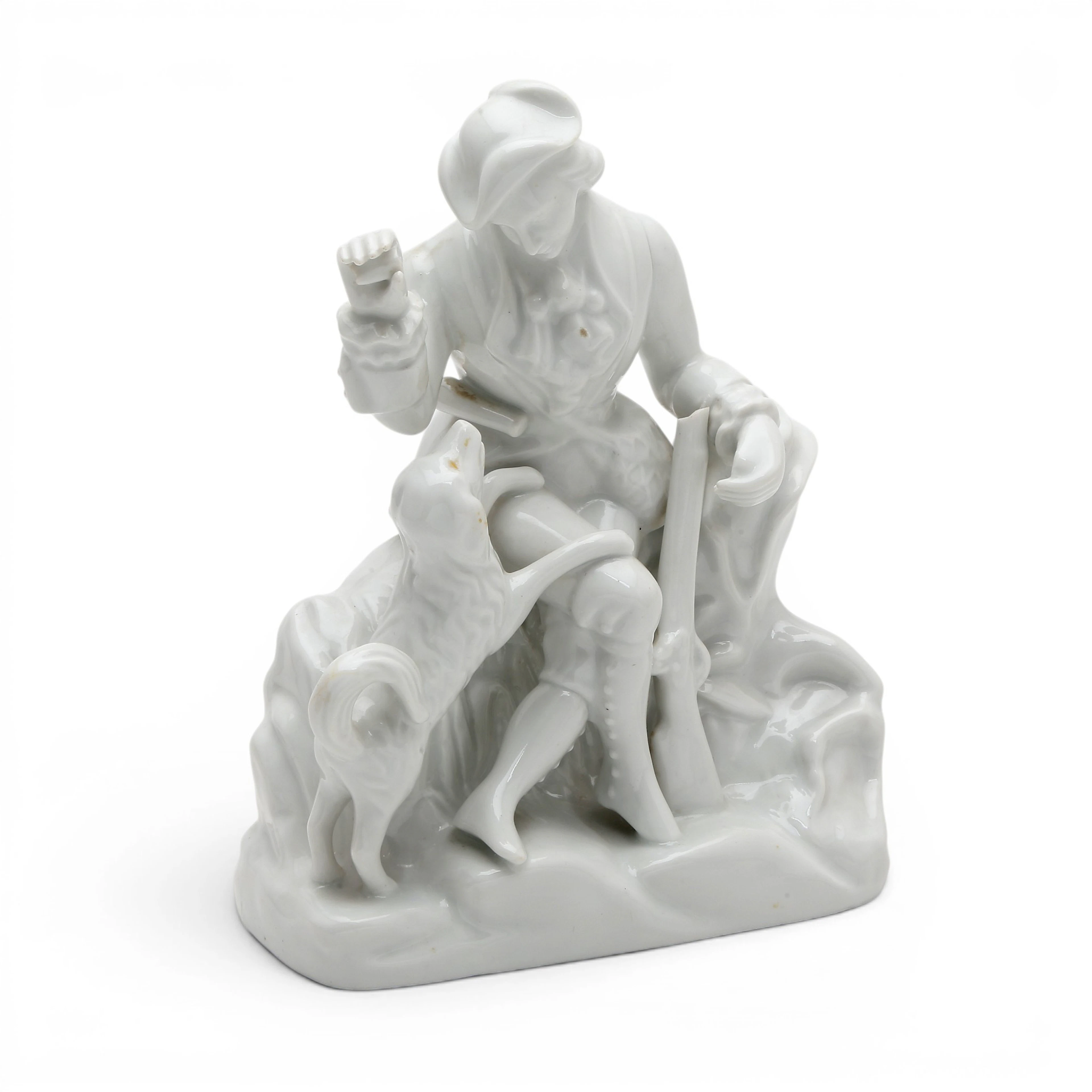 "Hunter with a dog", glazed porcelain figure by Santa Clara, 20th Century.