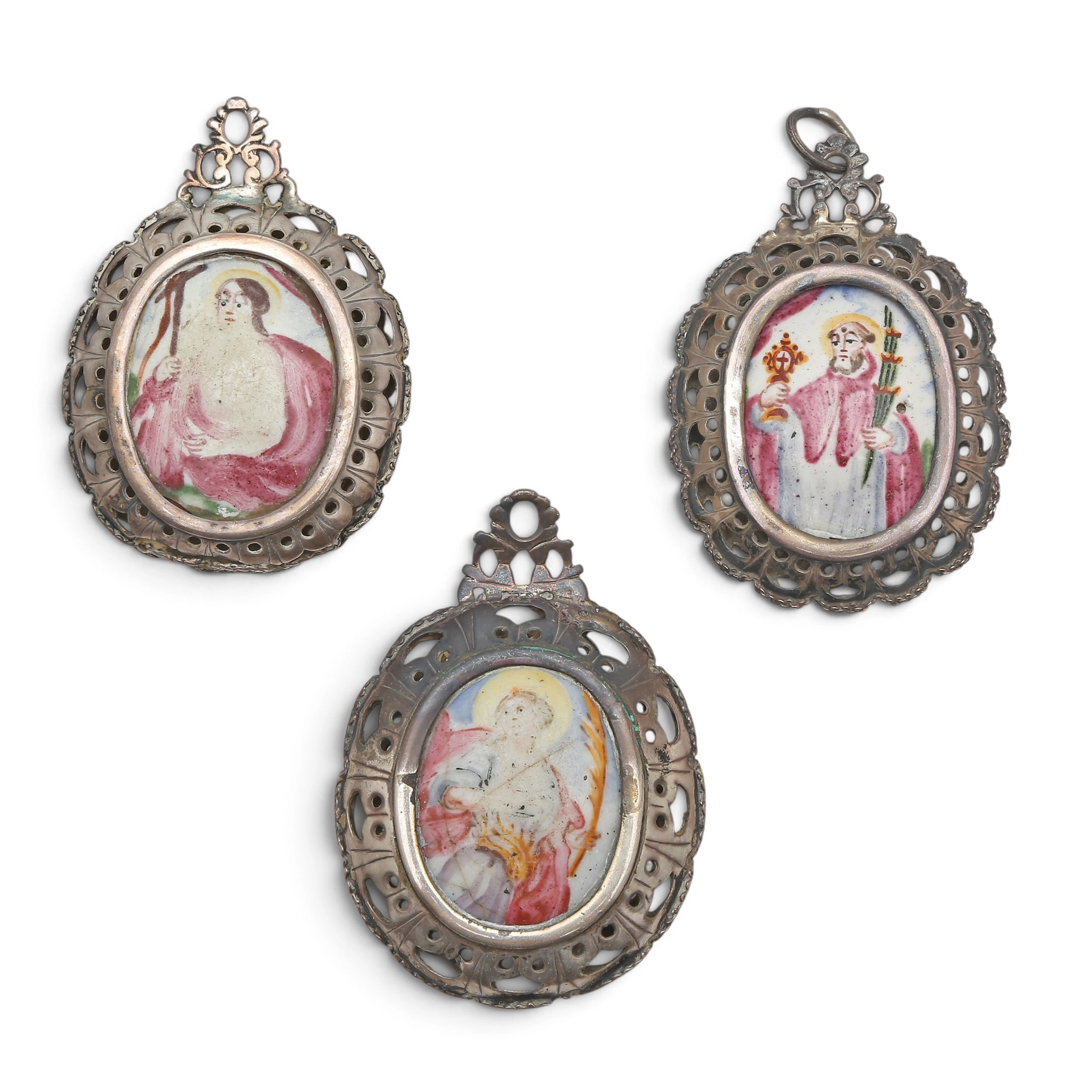 THREE devotional pendants in silver and enamel, 18th century.