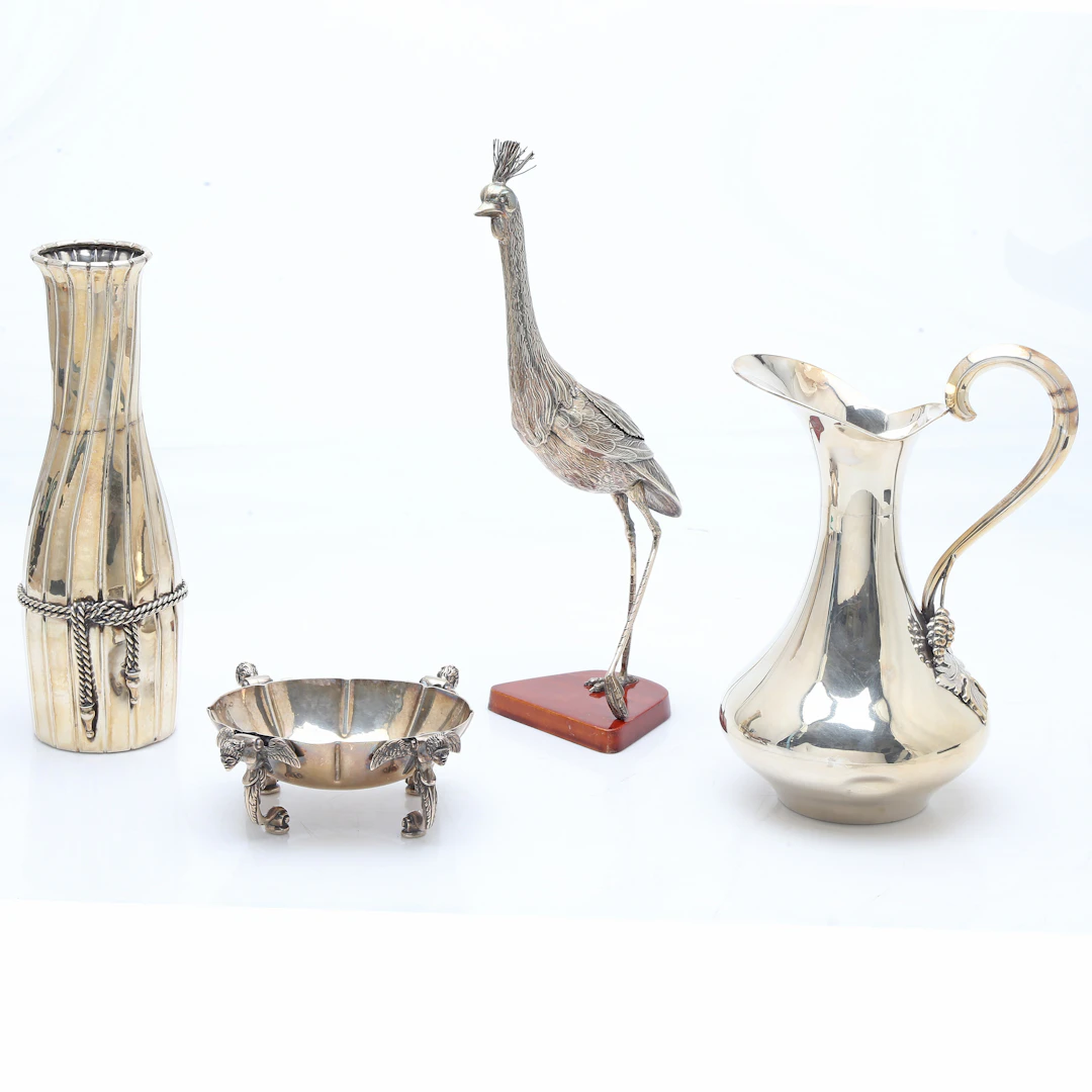Crane, jug, vase and centrepiece in silver, third quarter of the 20th Century.