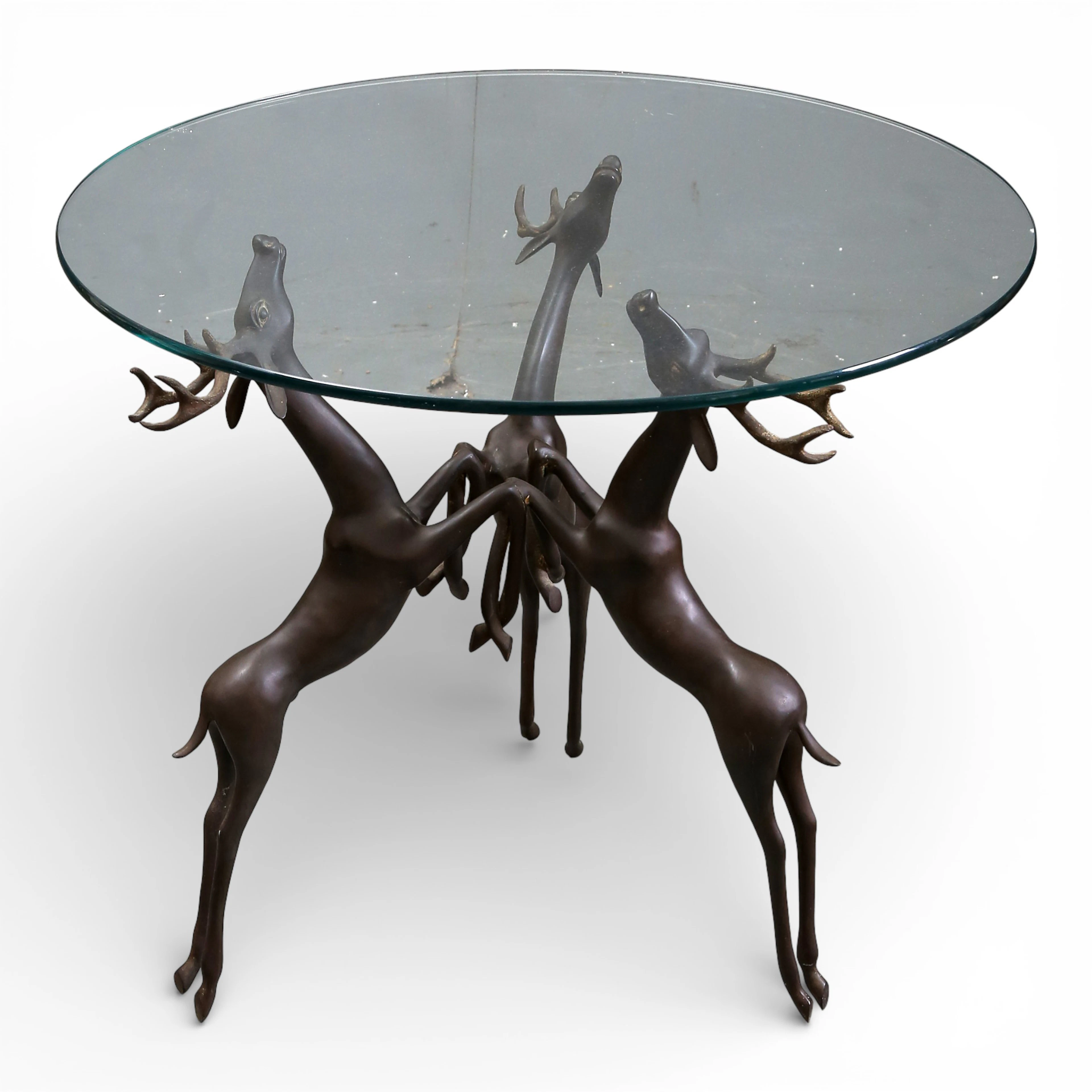 Round coffee table in bronze and glass top, mid 20th Century.