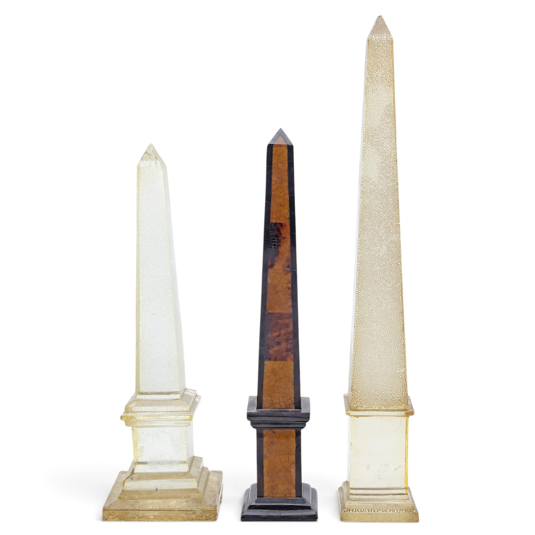 Three resin obelisks.