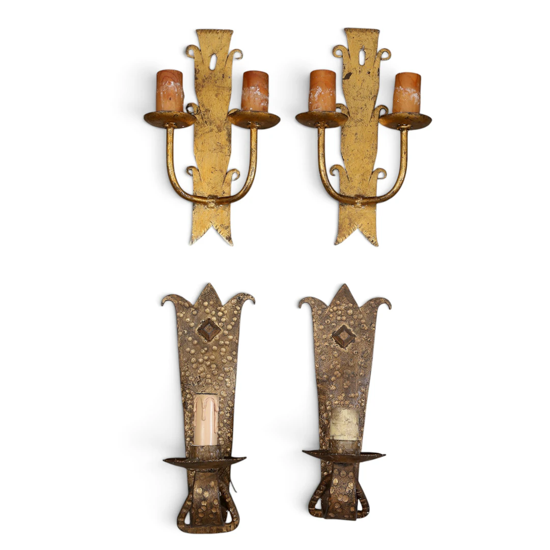 Two pairs of wall lamps in gilt wrought iron, circa 1960.