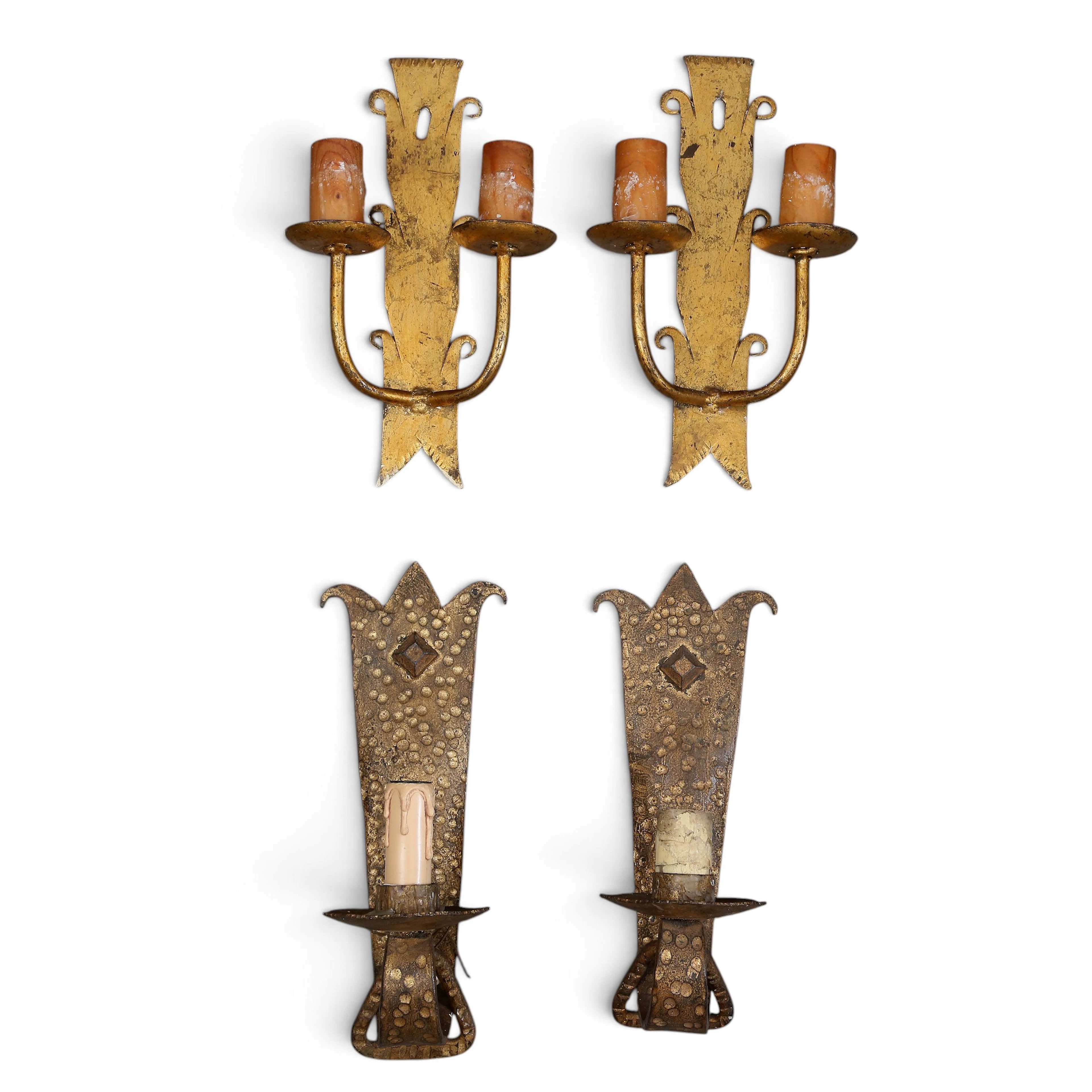 Two pairs of wall lamps in gilt wrought iron, circa 1960.