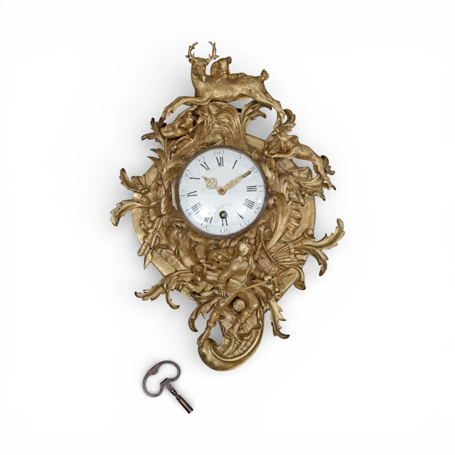 FRENCH Louis XV “cartel” watch in gilded bronze, from the 18th century.